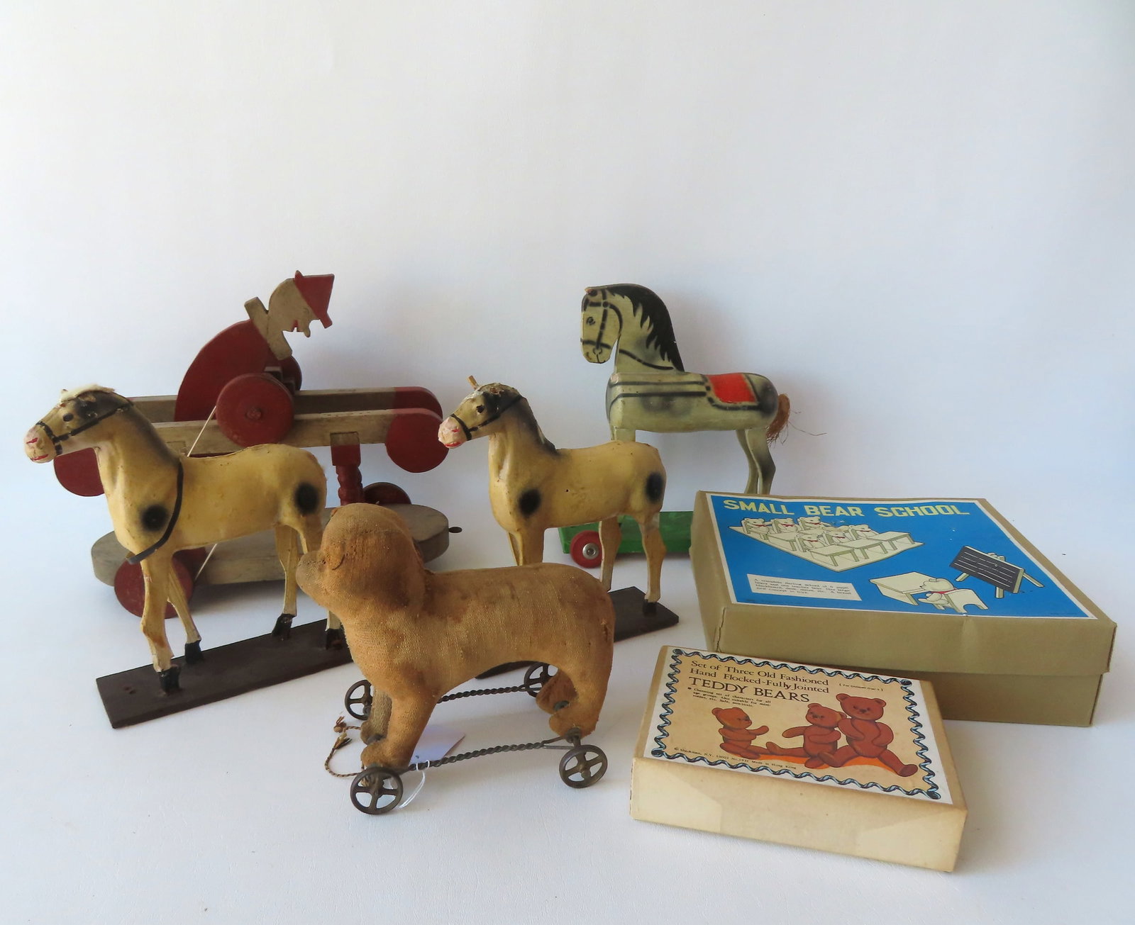 Grouping of 7 vintage toys including: A hand made mechanical acrobatic clown toy on wheels - rubber: Grouping of 7 vintage toys including: A hand made mechanical acrobatic clown toy on wheels - rubber bands were meant to attached to wheels caused the clown to tumble forward when pulled - it is missin