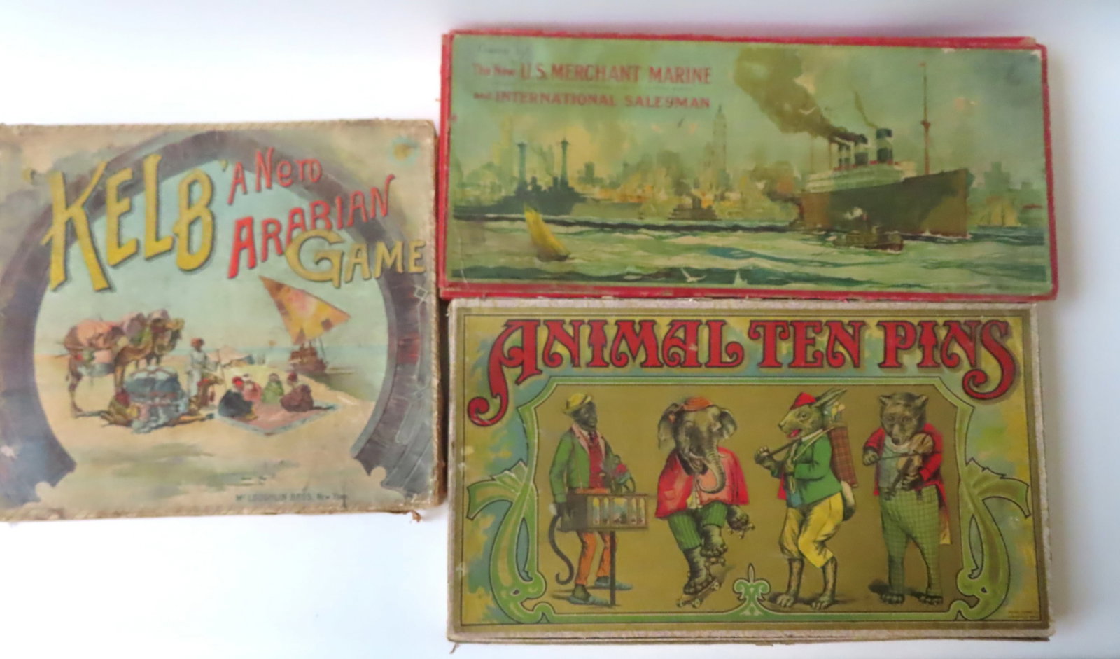 Three vintage board games in original boxes: "Kelb - A Nerd Arabian Game" by McLoughlin Bros -: Three vintage board games in original boxes: "Kelb - A Nerd Arabian Game" by McLoughlin Bros - missing one of the circular red playing pieces (like checkers), otherwise complete and in good condition;