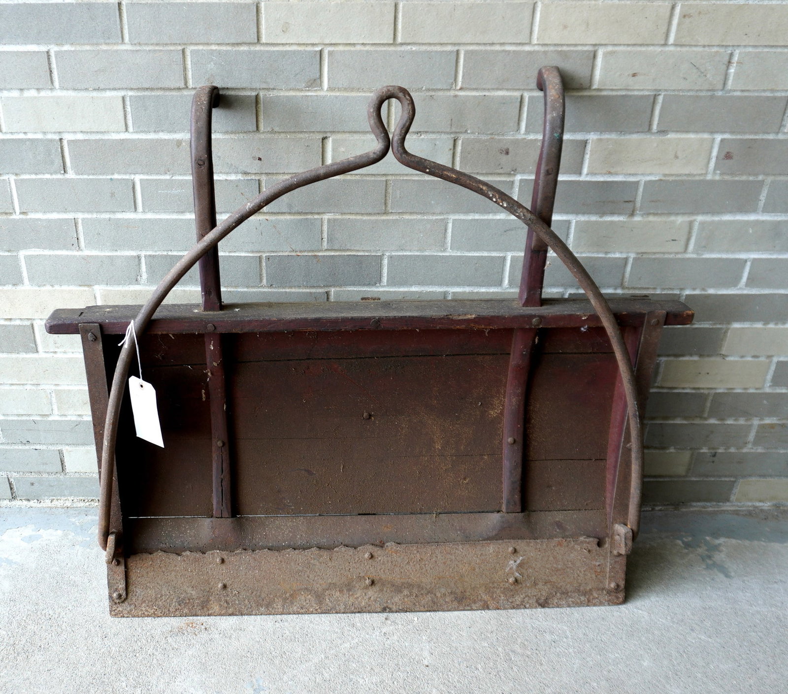 An unusual horse drawn road scraper with original handle, 19th century.: An unusual horse drawn road scraper with original handle and hand forged iron bail and straps, original red paint, probably mid 19th century. Good condition. Measures 40"D x 37 1/2" x 8"D