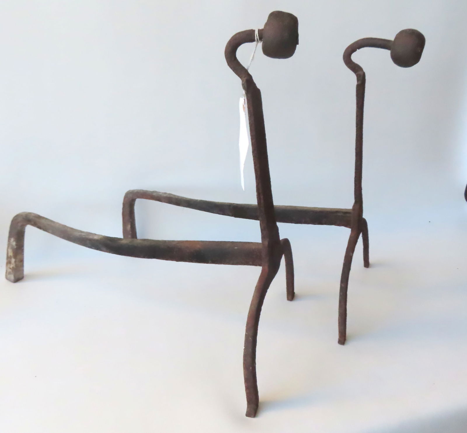An early pair of hand forged goose neck andirons with ball terminals.: An early pair of hand forged goose neck andirons with ball terminals, late 18th century. Some surface rust and pitting, but overall good condition. Measures 18"H.