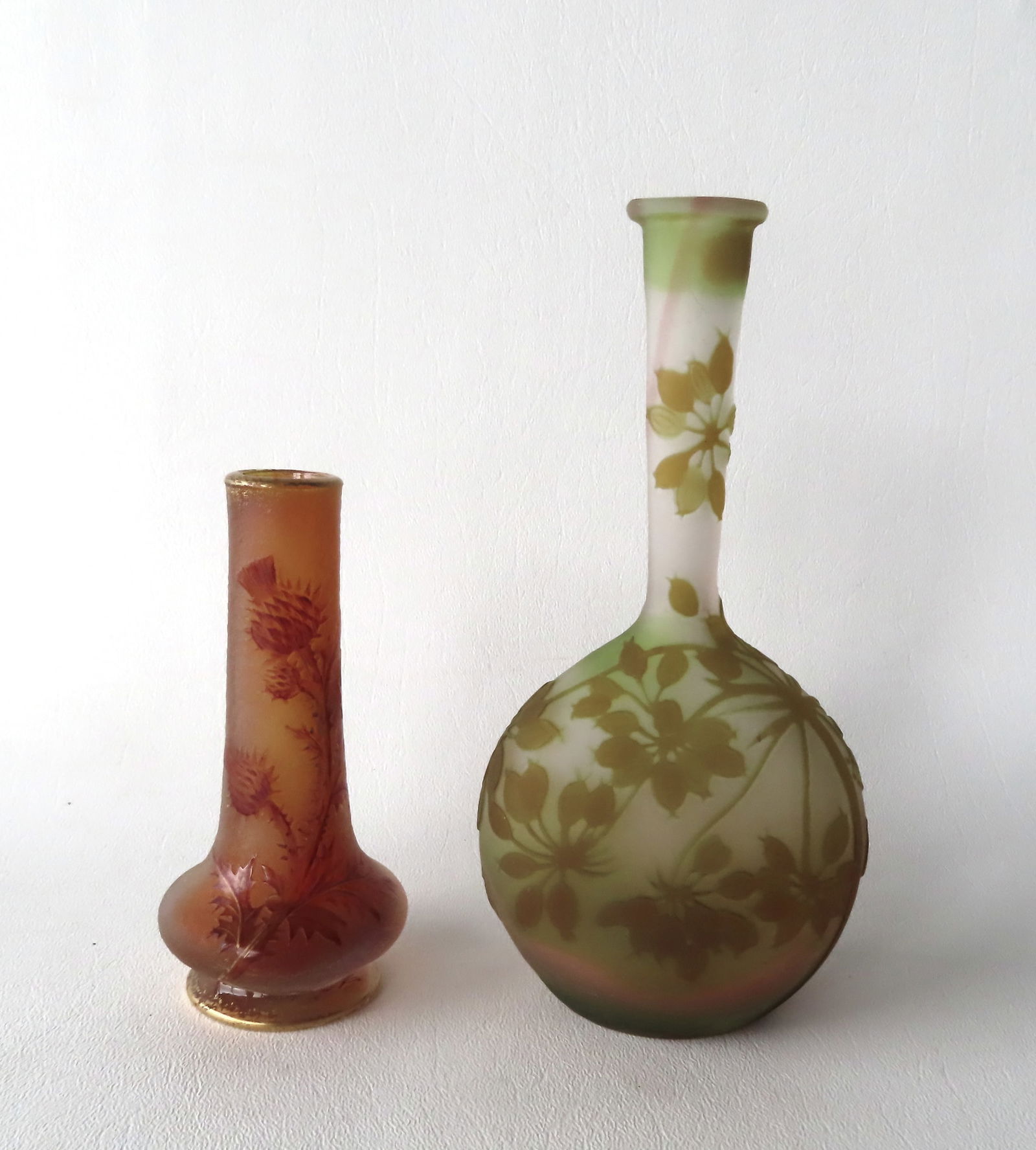 Two pieces of art glass - Daum Nancy & Galle vases.: A small art glass bud vase signed Daum Nancy, acid etched and decorated with thistle flowers and in very good condition - 4 3/4"H - circa 1920; together with a small Galle vase - it appears to have a