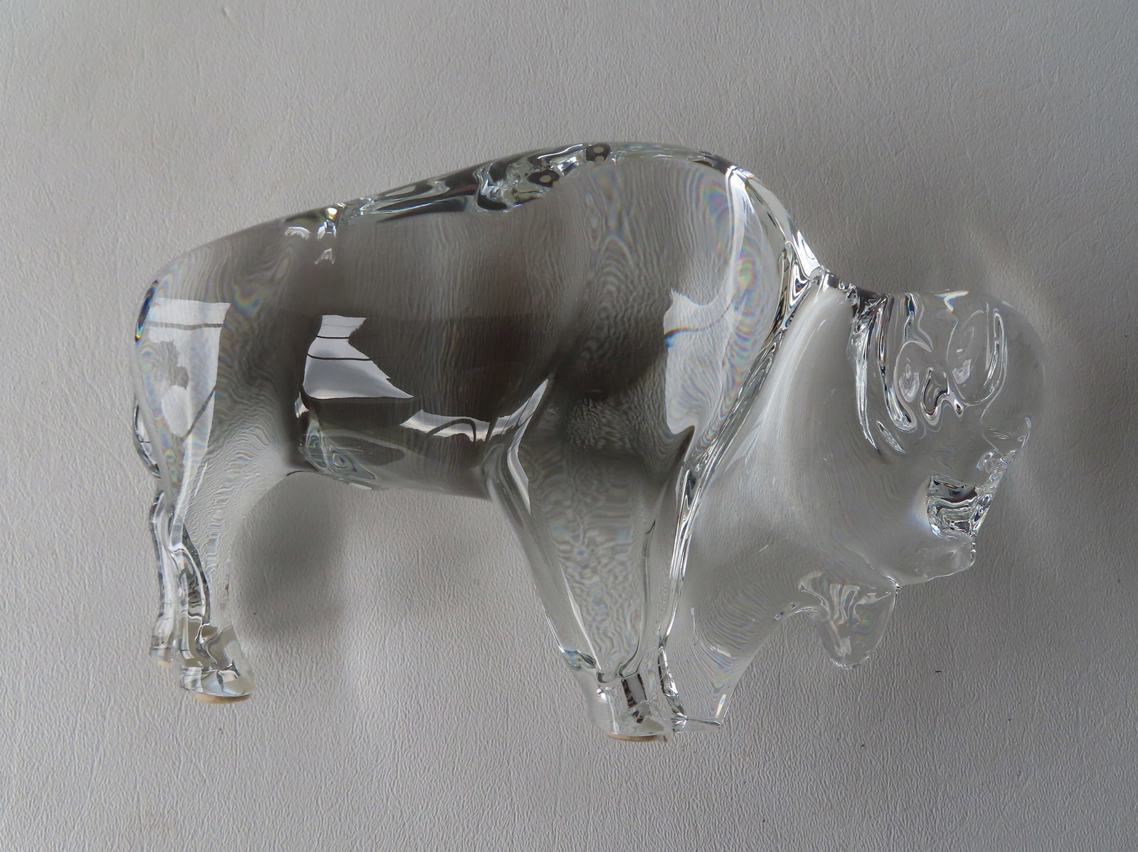 A signed "Baccarat France" crystal buffalo figure: A signed "Baccarat France" crystal buffalo figure - tiny flea chip on edge of front foot, hardly noticeable, else very good condition. Measures 7 3/4"L x 5 1/4"H. Provenance: From a prominent Westches