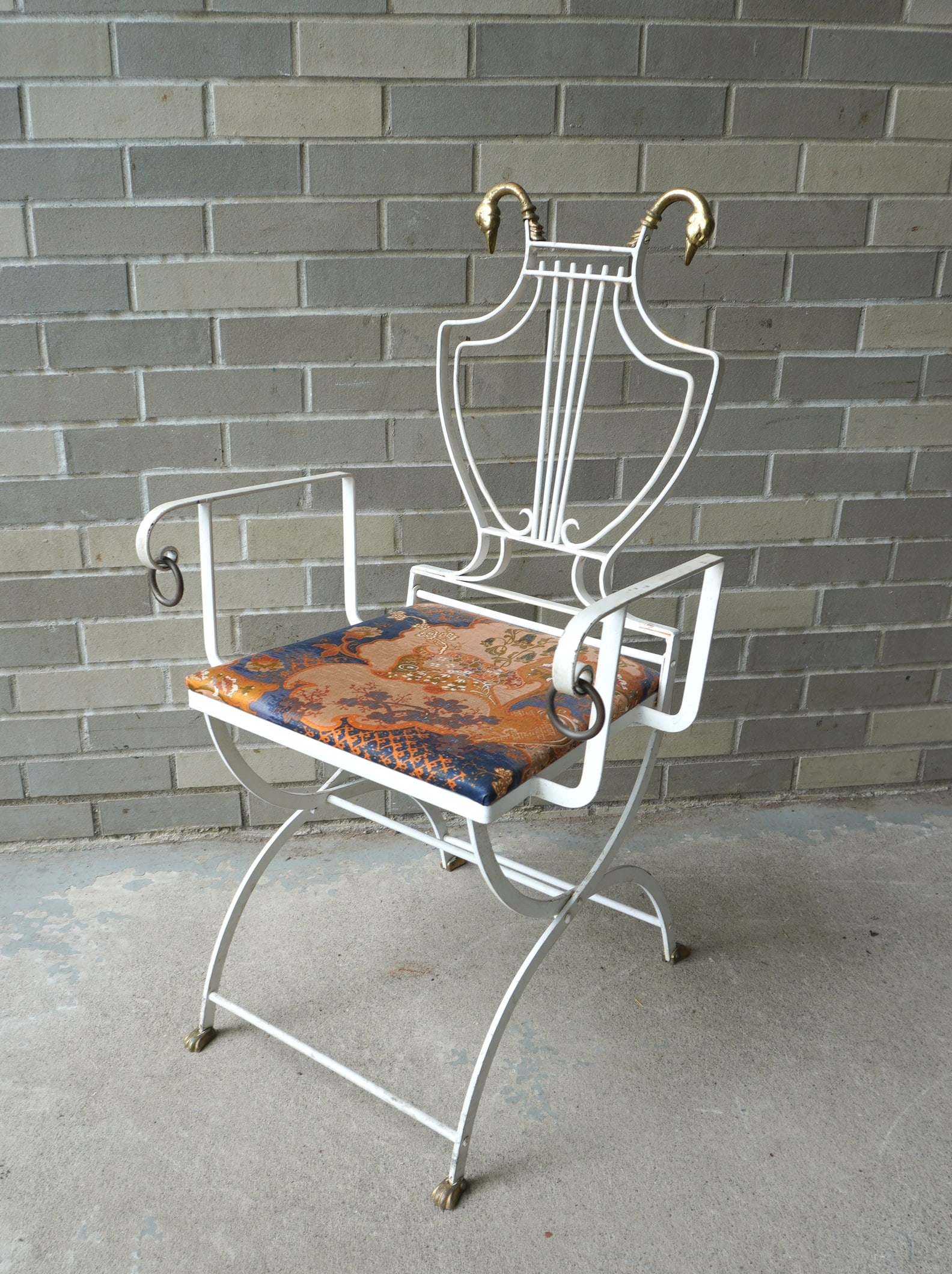An unsusual iron and brass side chair, circa 1930, very good condition.: An unsusual iron and brass side chair,in old white paint and having brass swan finials and claw feet, very good condition, circa 1930.