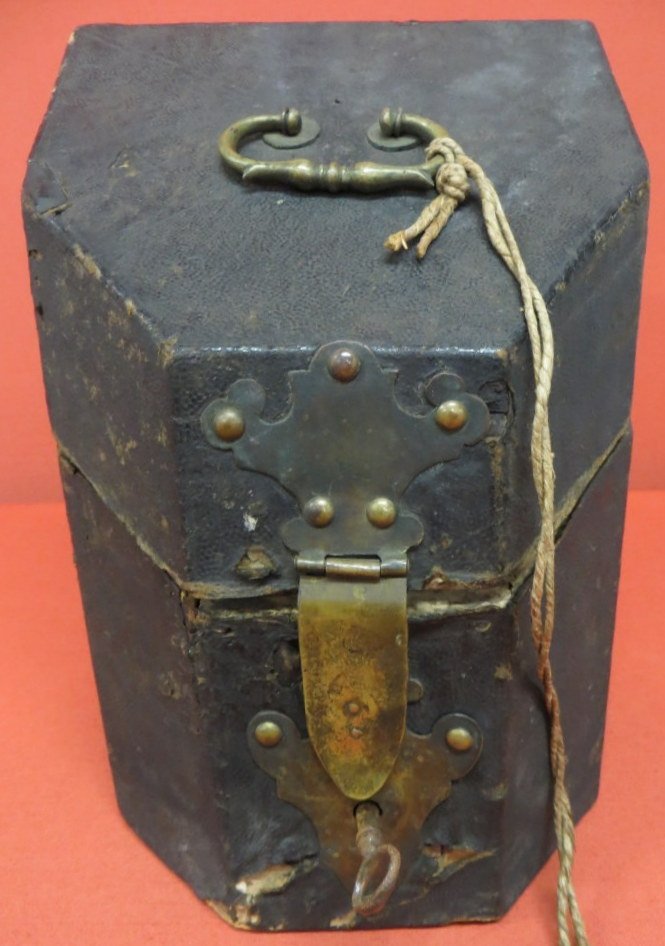 Early knife box wrapped in leather - hand made bra: Early knife box wrapped in leather - hand made brass lock and handle - probably 18th century - original fitted interior. 10"H.