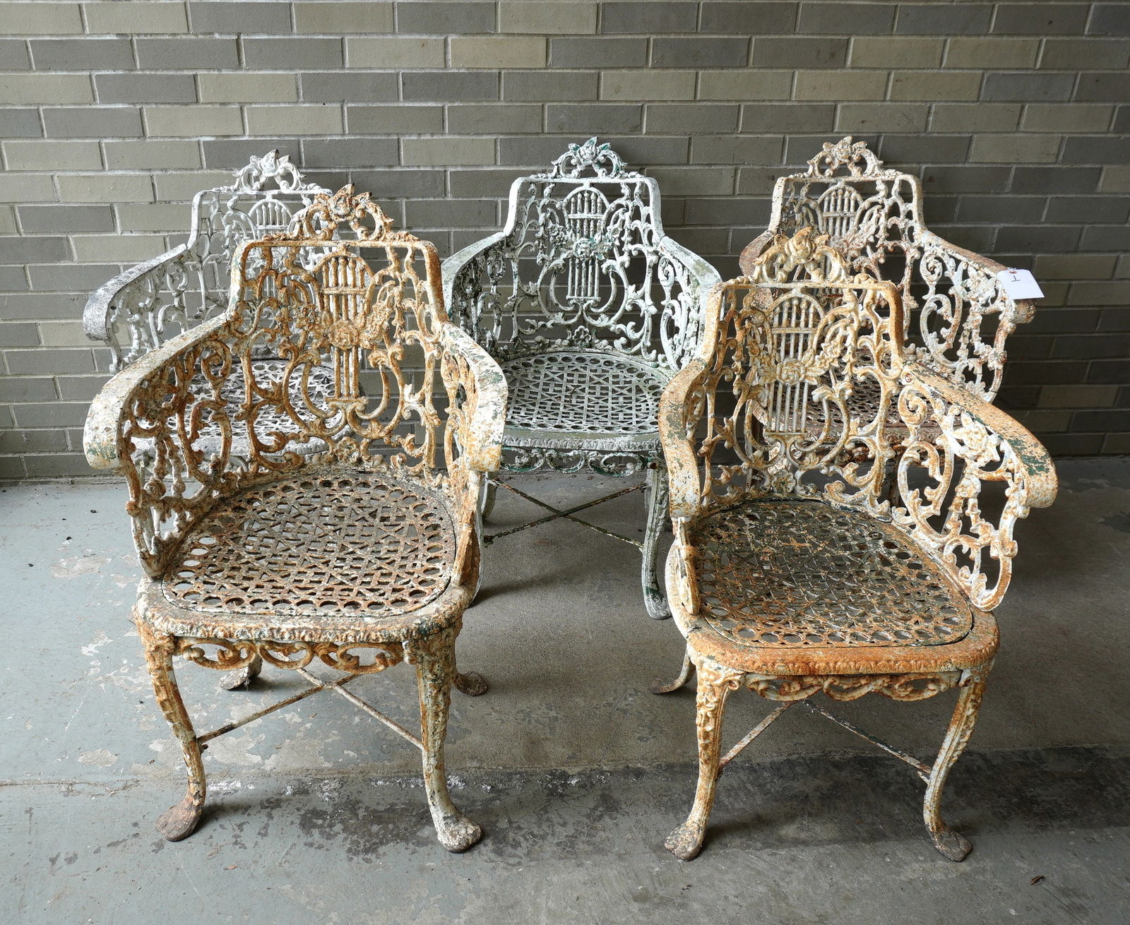 A near matched set of 5 lyre back garden chairs, decorated with roses and scrolls and having pierced (1 of 15)