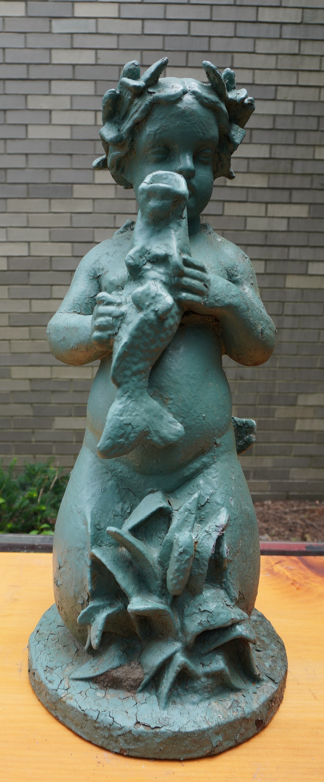 A vintage cast iron mermaid form garden water fountain. The mermaid holding fish with open mouth (1 of 6)