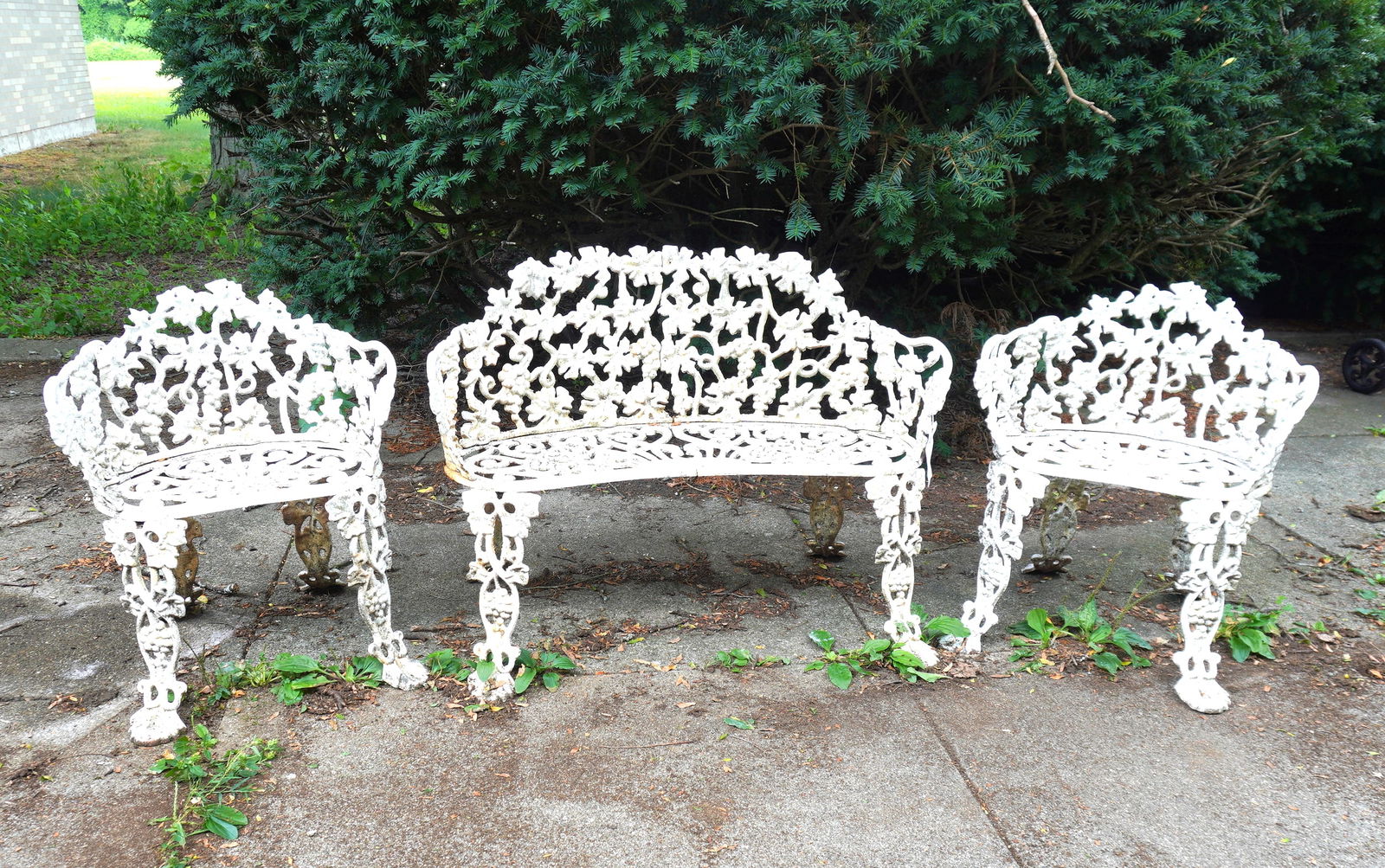 Cast iron grape and leaf pattern garden set consisting of a settee and 2 matching side chairs, circa (1 of 5)