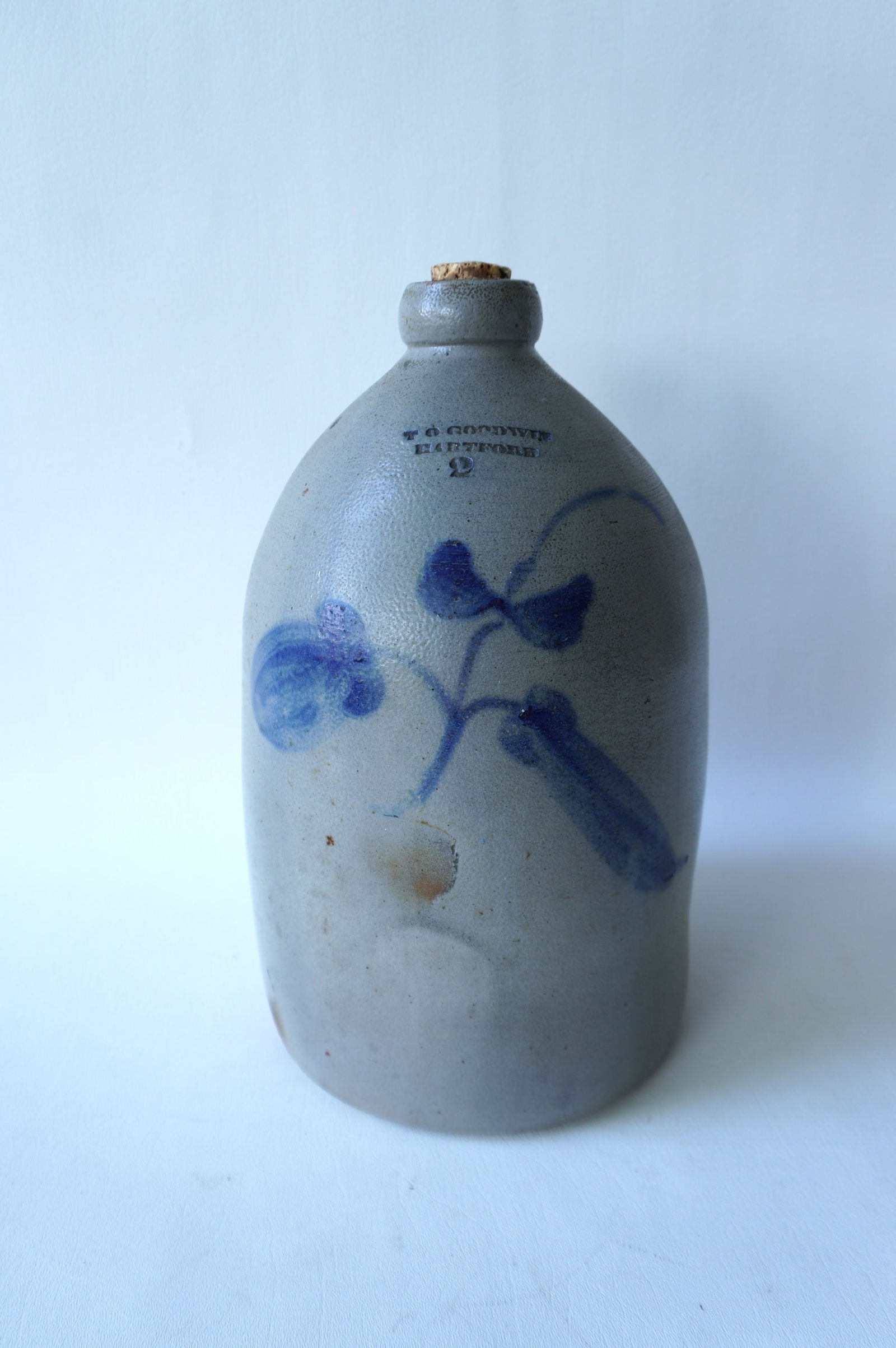 Stoneware jug, 2 gallon, decorated with a cobalt blue flower, with the impressed mark of T. O. (1 of 5)