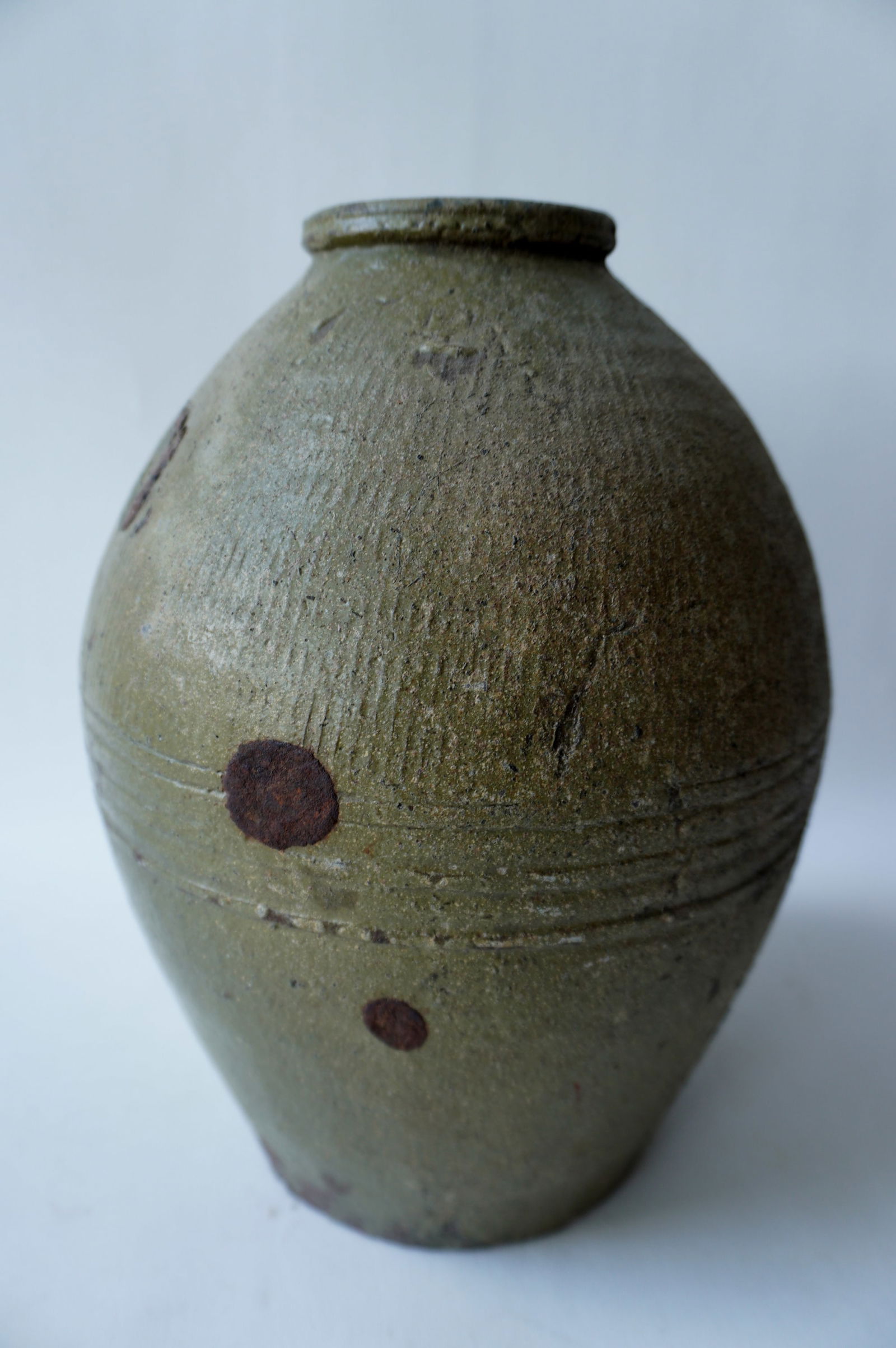 Unusual redware pot with green glaze, the top half section with vertical fluting that meets a (1 of 8)