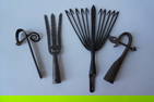 Grouping of early iron including 2 hand forged iron eel spears, the largest - 16"H x 10 1/4"W and 2