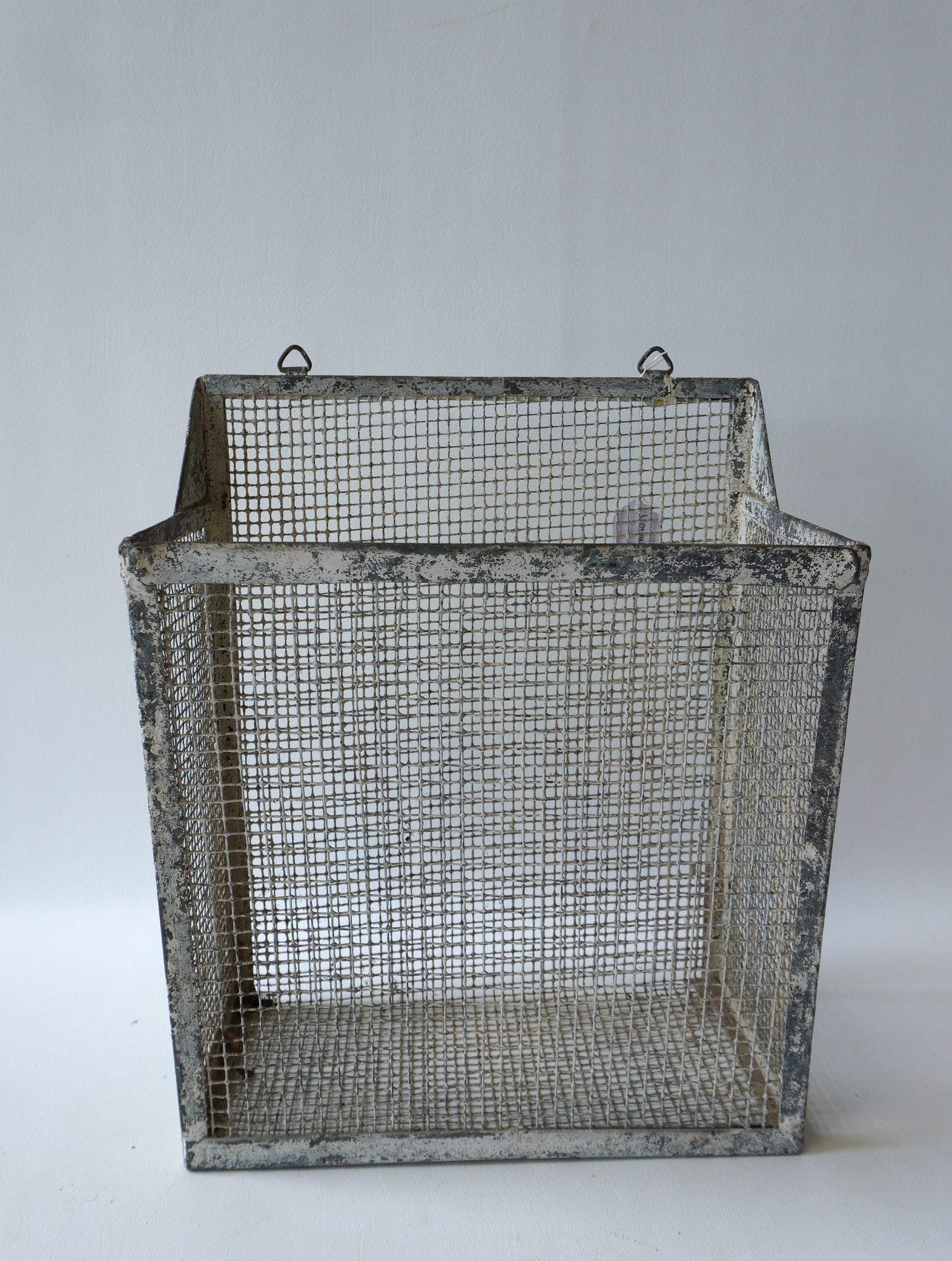 An unusual hanging wire drying basket with canted front,  in traces of old white paint, 19th (1 of 4)