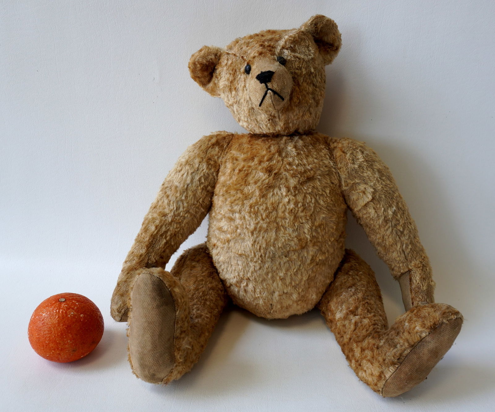 A jointed Teddy Bear with hunch back and shoe button eyes. Several small areas of fur losses, else (1 of 11)