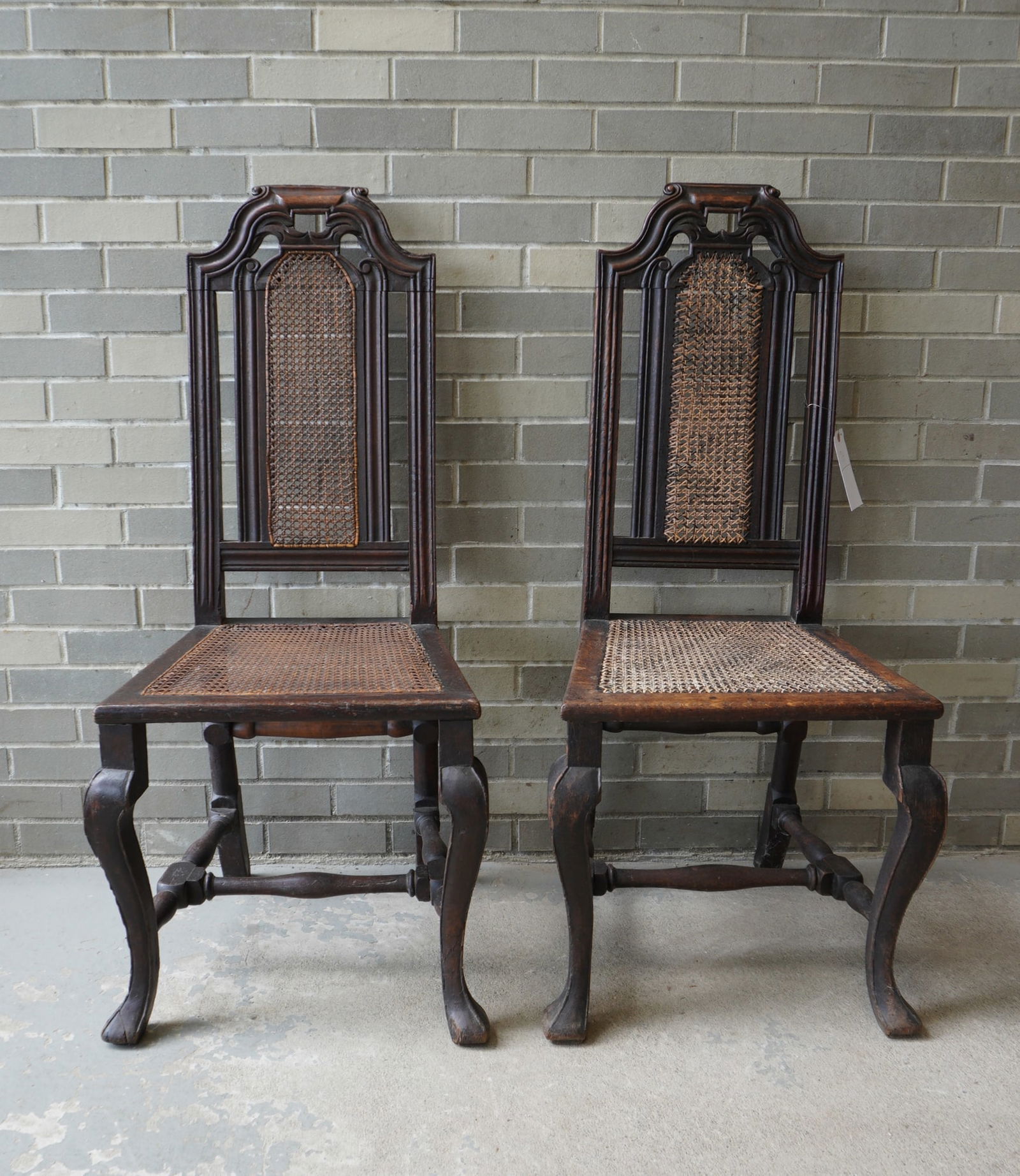 A matched pair of dark oak William & Mary early 18th century side chairs with cane seats and back, (1 of 11)