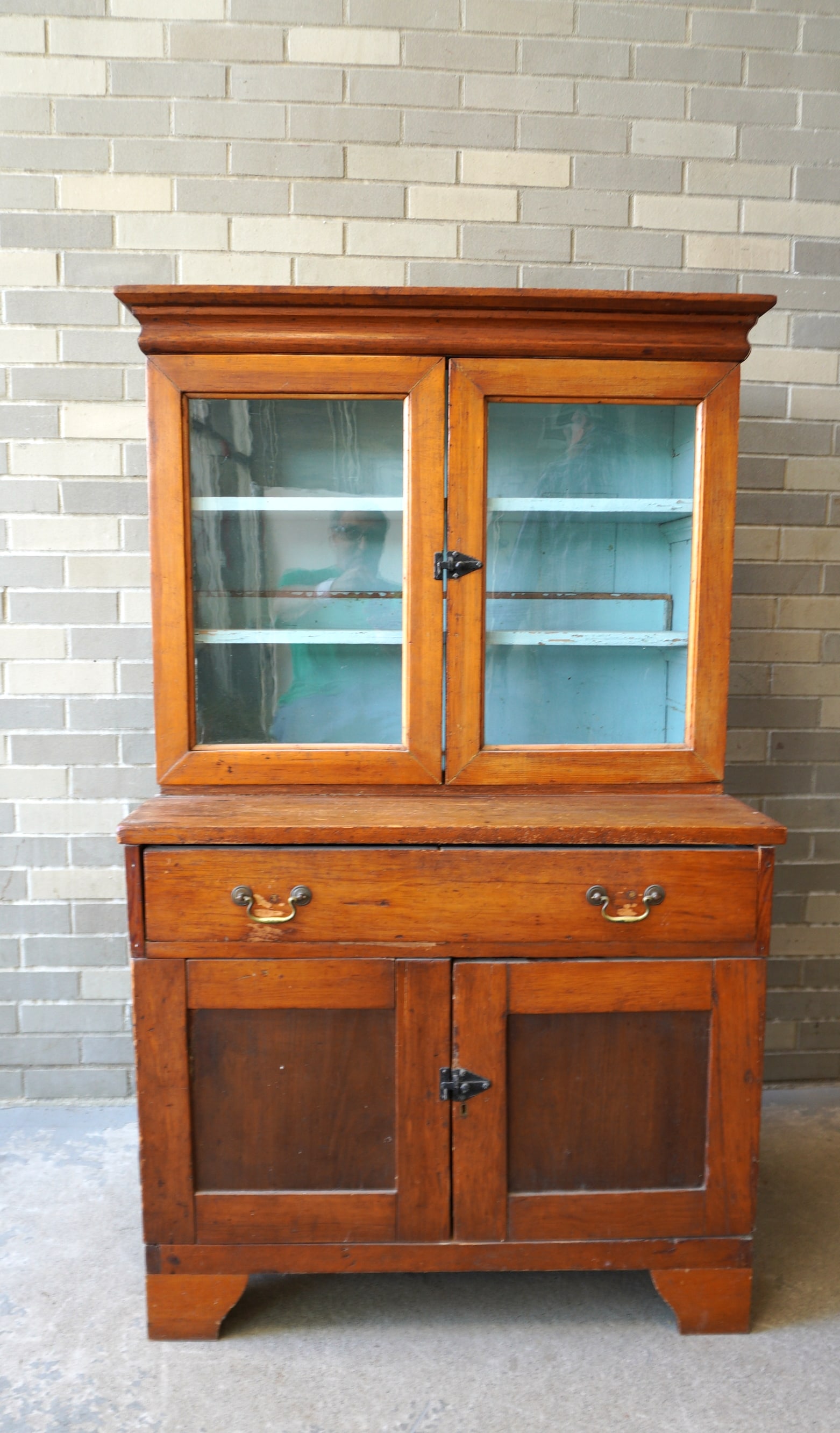 A pine step-back cupboard have ogee crown molding over 2 glass doors over 1 long drawer over 2 (1 of 7)