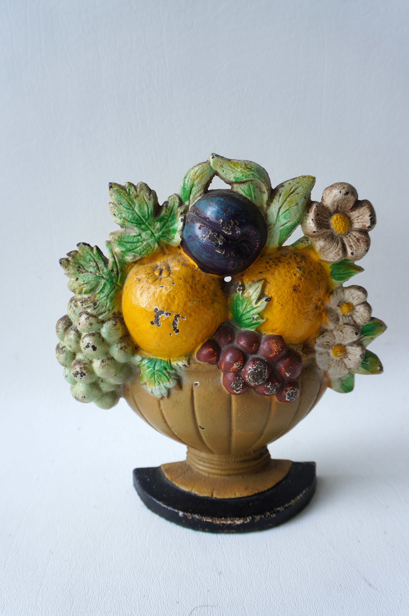 Cast iron door stop in the form of a bowl of fruit - #456, bright original paint, very good: Cast iron door stop in the form of a bowl of fruit - #456, bright original paint, very good condition. Measures 7"H x 6 1/2"W.