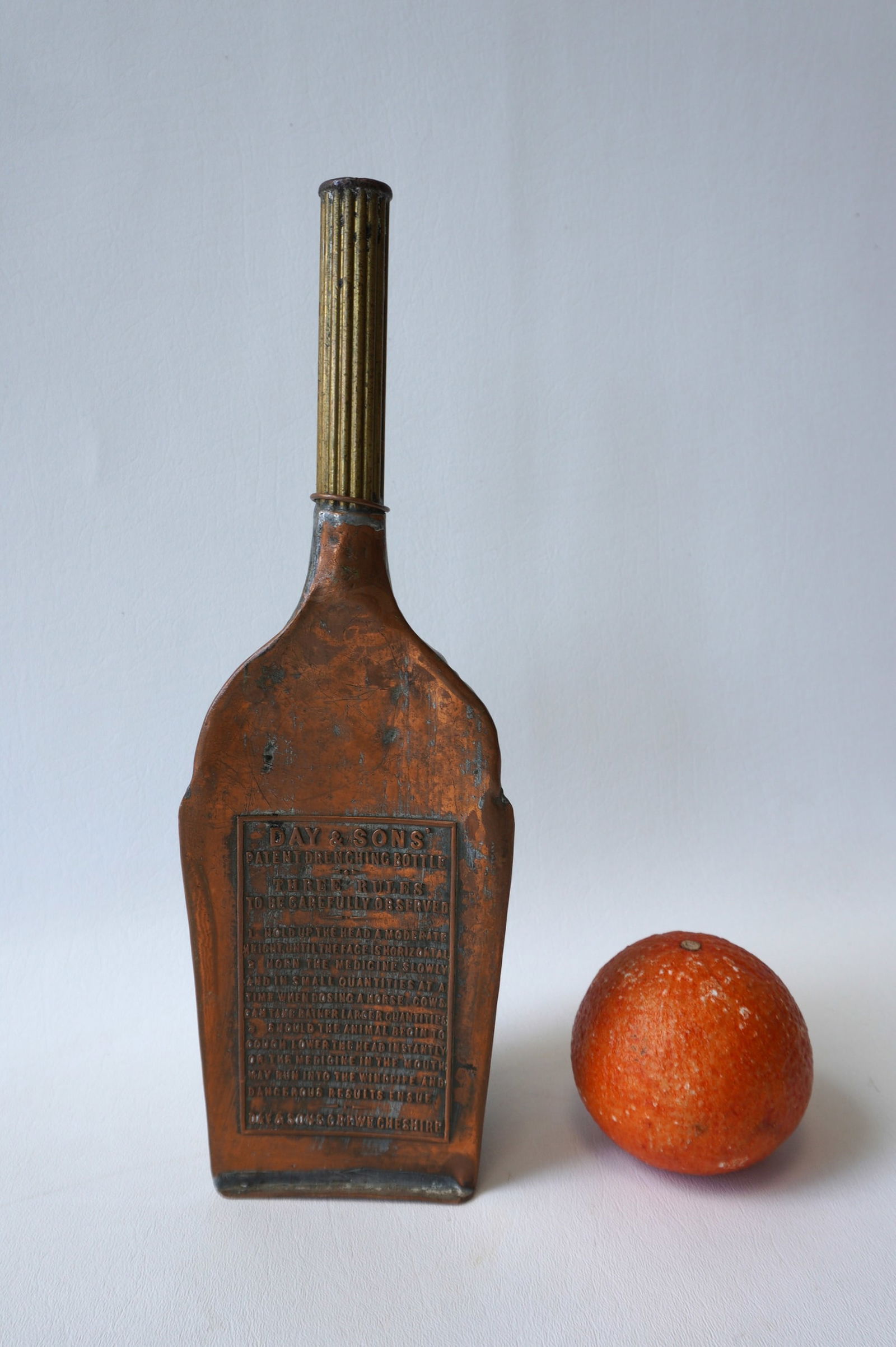 A rare English copper veterinary drenching bottle signed Day & Sons, good condition. Drenching: A rare English copper veterinary drenching bottle signed Day & Sons, good condition. Drenching bottles used for the forceful pouring of liquid (medication) down the throat of animal, including livesto