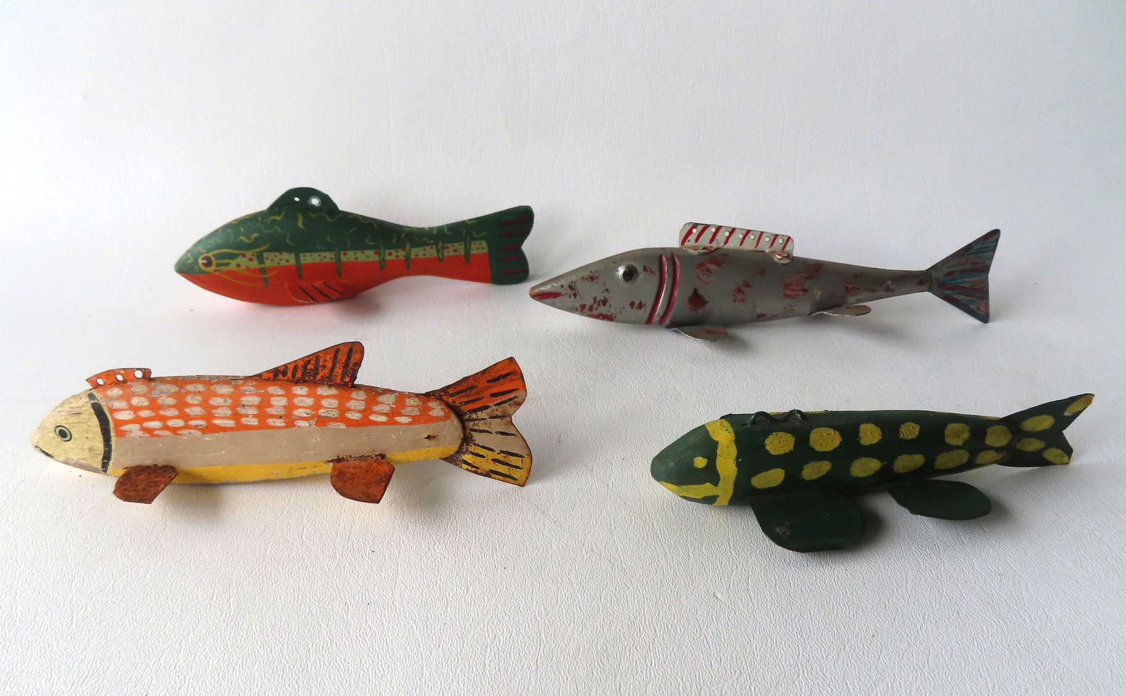 Grouping of 4 carved ice fishing decoys in original paint, with painted metal fins and 3 with (1 of 14)