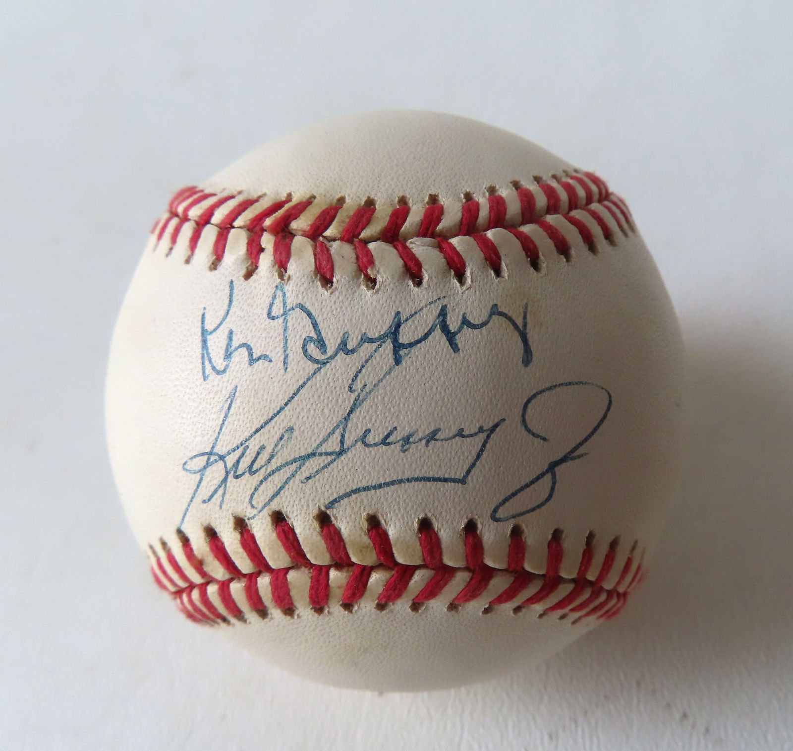 An  authentic Ken Griffey and Ken Griffey Jr. autographed baseball, within sealed display case with (1 of 6)