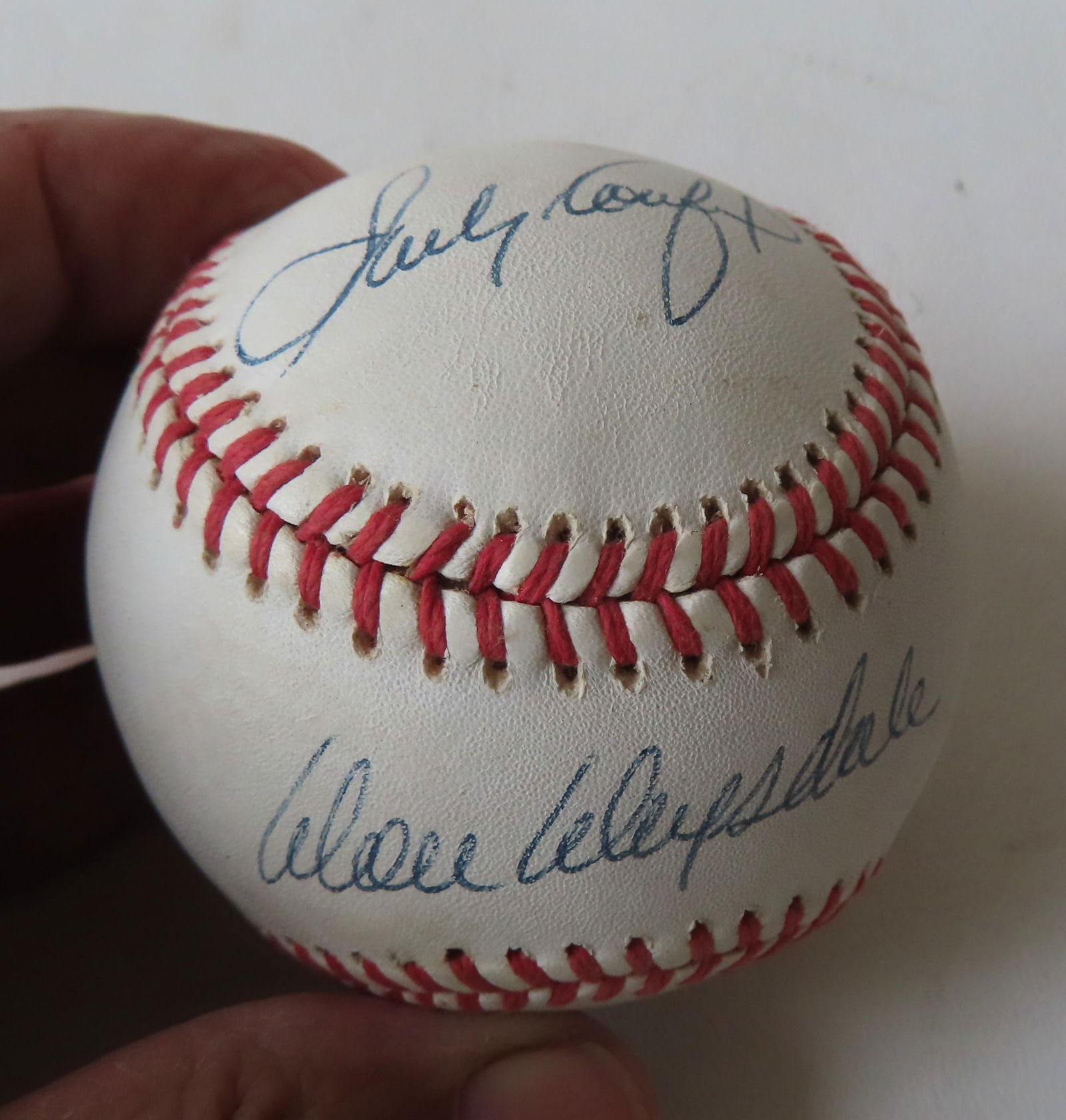 An authentic autographed baseball signed by Sandy Koufax and Don Drysdale. The baseball stamped (1 of 8)