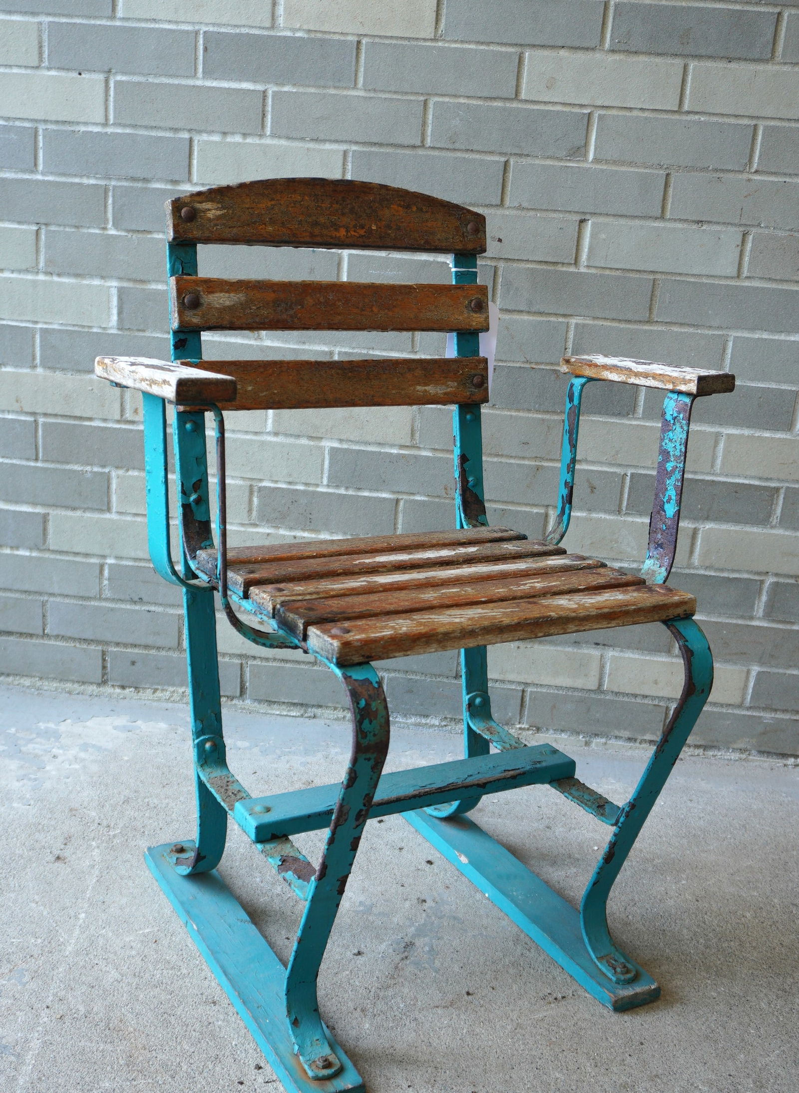 An original Ebbets Field stadium press-box seat, having a strap iron frame and horizontal wooden (1 of 6)