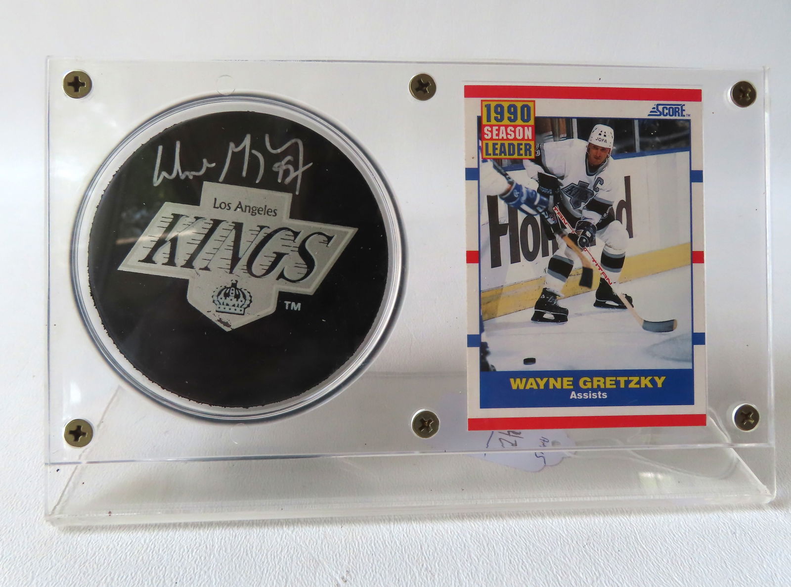 A Los Angeles Kings Wayne Gretzky autographed hockey puck, together with his 1990 #352 "Score" (1 of 4)