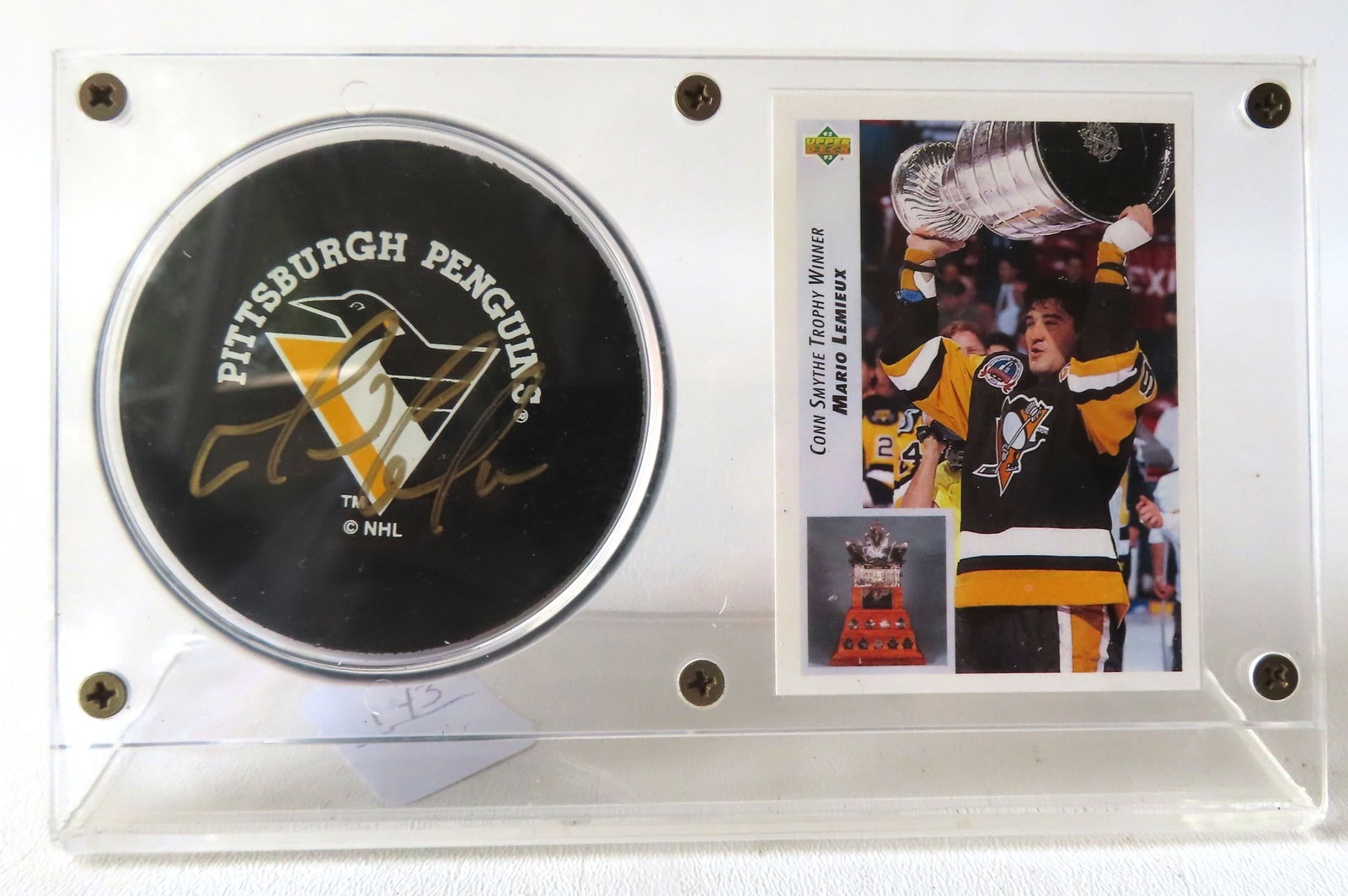 A Pittsburgh Penguins Mario Lemieux autographed hockey puck, together with his #436 hockey card, (1 of 4)