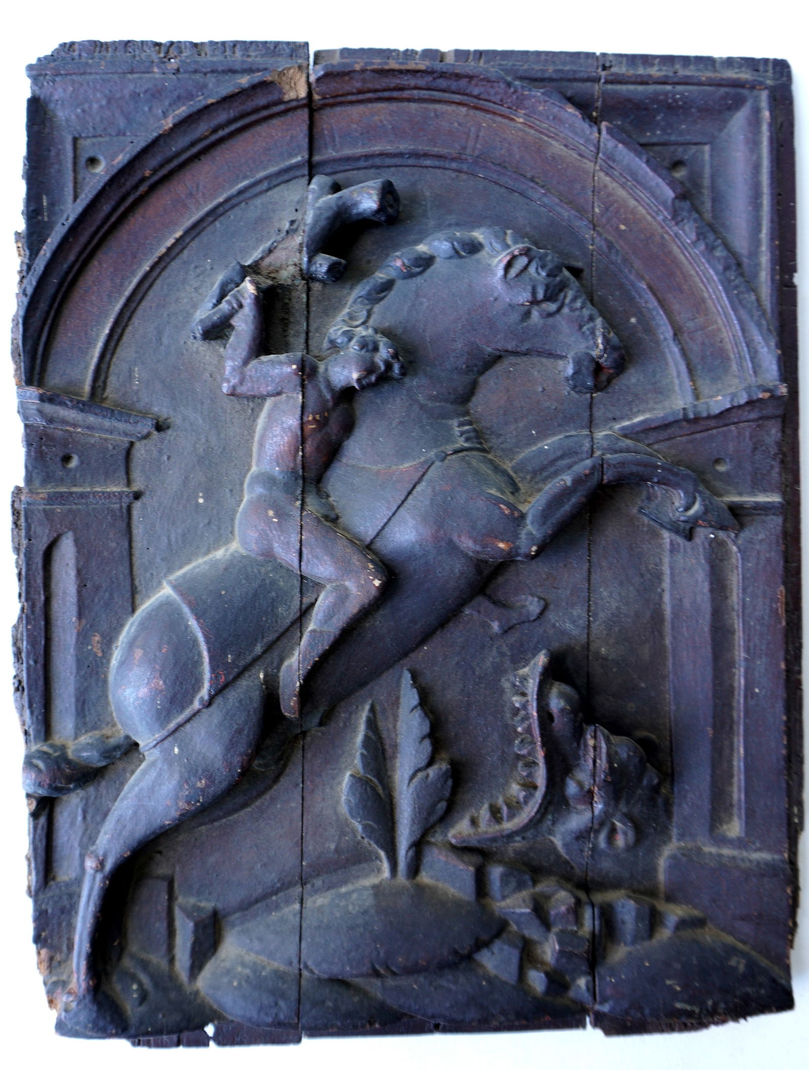 An early relief carved wooden panel depicting St. George and the Dragon, probably 17th/18th century (1 of 2)