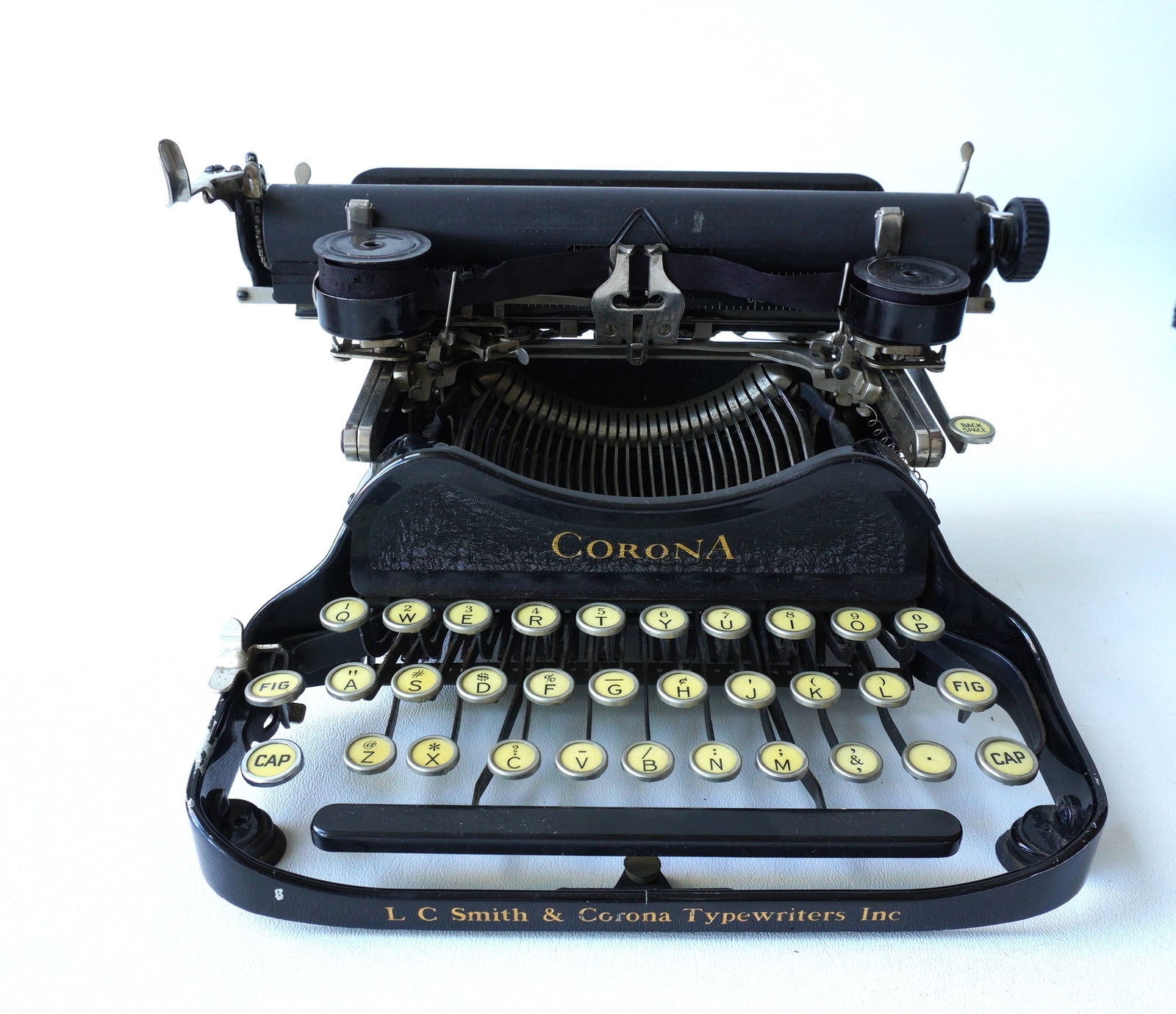A Corona folding typewriter in original box, good condition. Measures 12"W x 10"D x 5"H. (1 of 9)