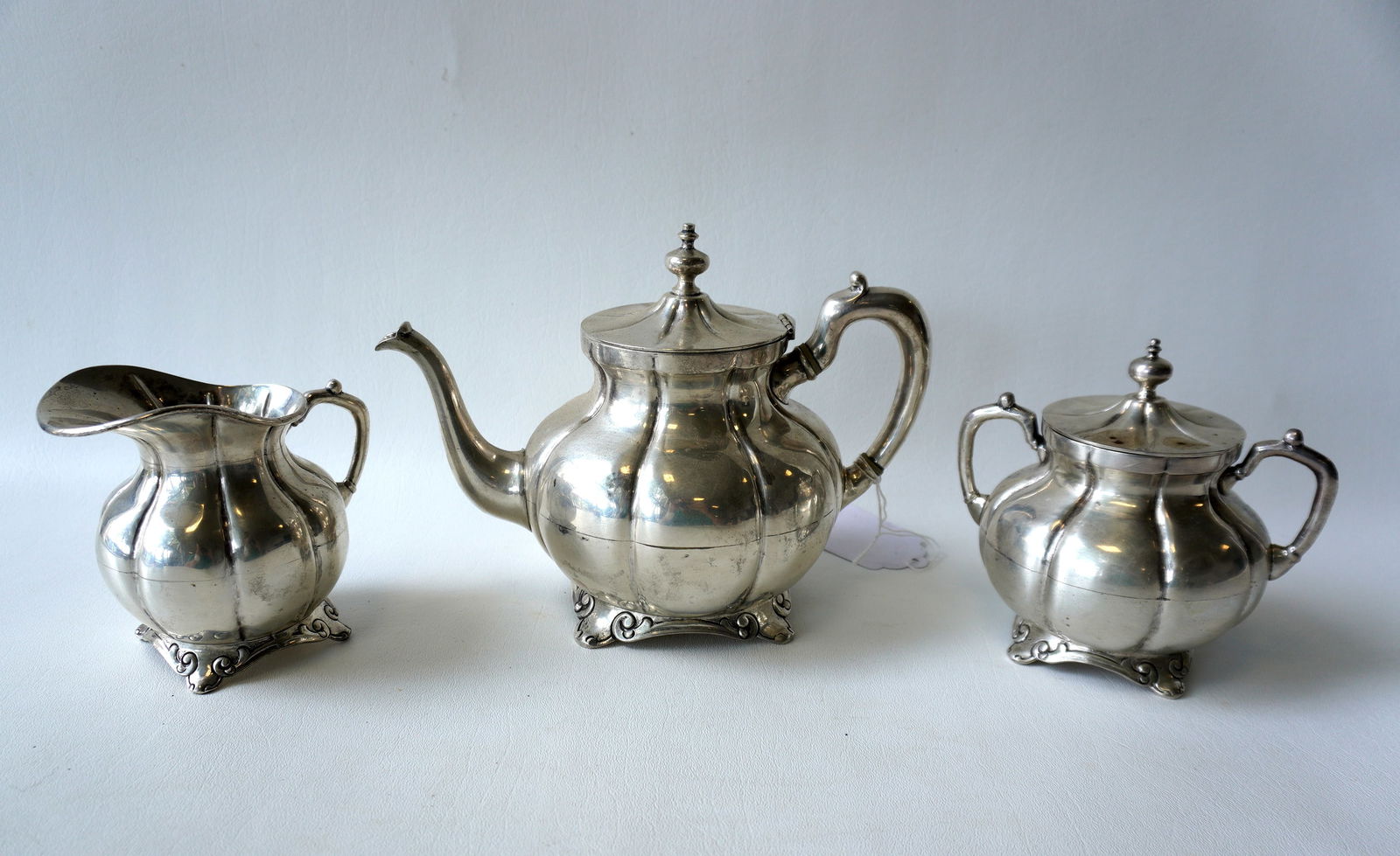 A Taxco Mexico 3 piece sterling tea set, ribbed design signed MV. The teapot with small ding in one (1 of 6)