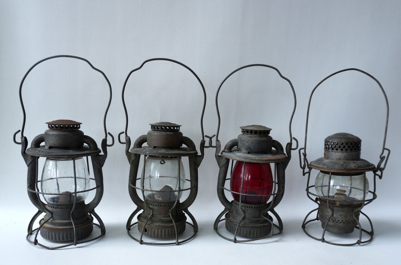 Grouping of 4 railroad lanterns. One unsigned and 3 marked NY Central System. Note that one of the (1 of 11)