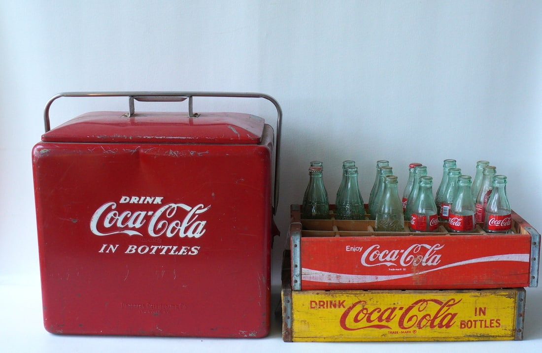 A grouping of Coca Cola collectibles including: Two Coca Cola wooden bottle crates, one in red and (1 of 11)