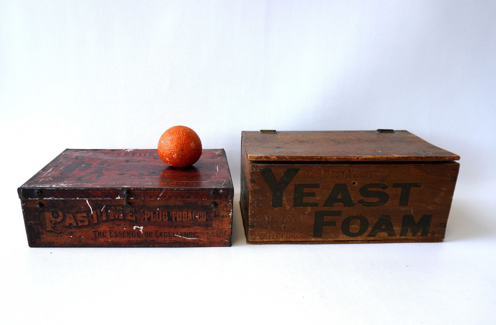 Two lithographed advertising boxes, one in tin, the other wood, both with wear but overall good (1 of 9)
