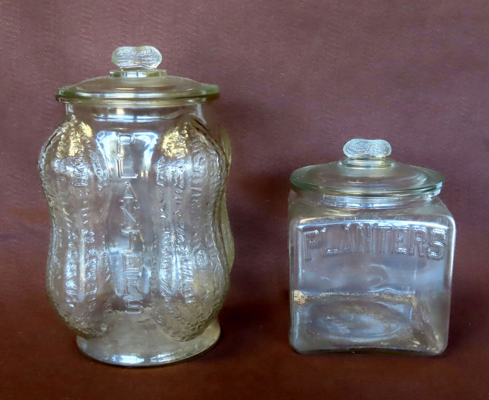 Two vintage Planter's Peanut jars with peanut shaped finials on lid. The smaller measures 9 1/4"H x (1 of 11)