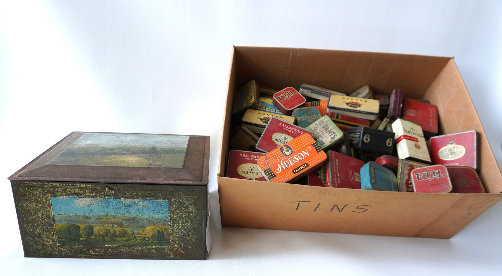 A large grouping of small lithographed advertising tins together with a larger cookie tin from the (1 of 13)