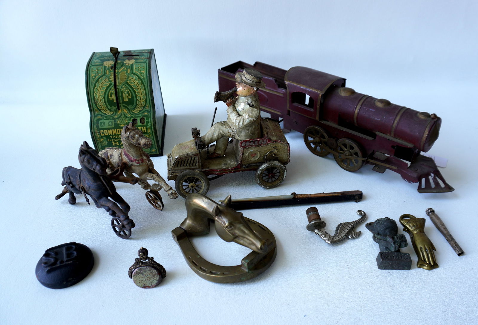 Grouping of vintage toys and collectibles including a lithograph tin Commonwealth registering bank, (1 of 13)