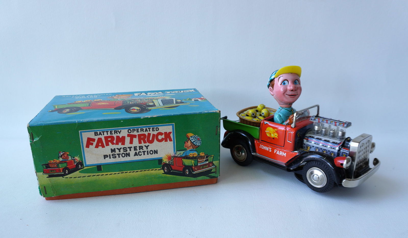 Vintage "Mystery Piston Action Farm Truck", battery operated, in original box (box with taped (1 of 7)