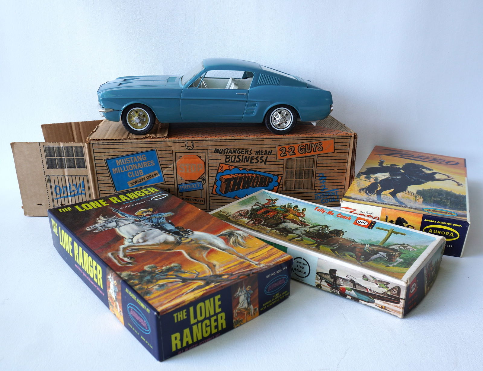 Grouping of vintage toys including: Motorized (Battery Op) 1967 Ford Mustang Fastback 2+2, 16" (1 of 20)