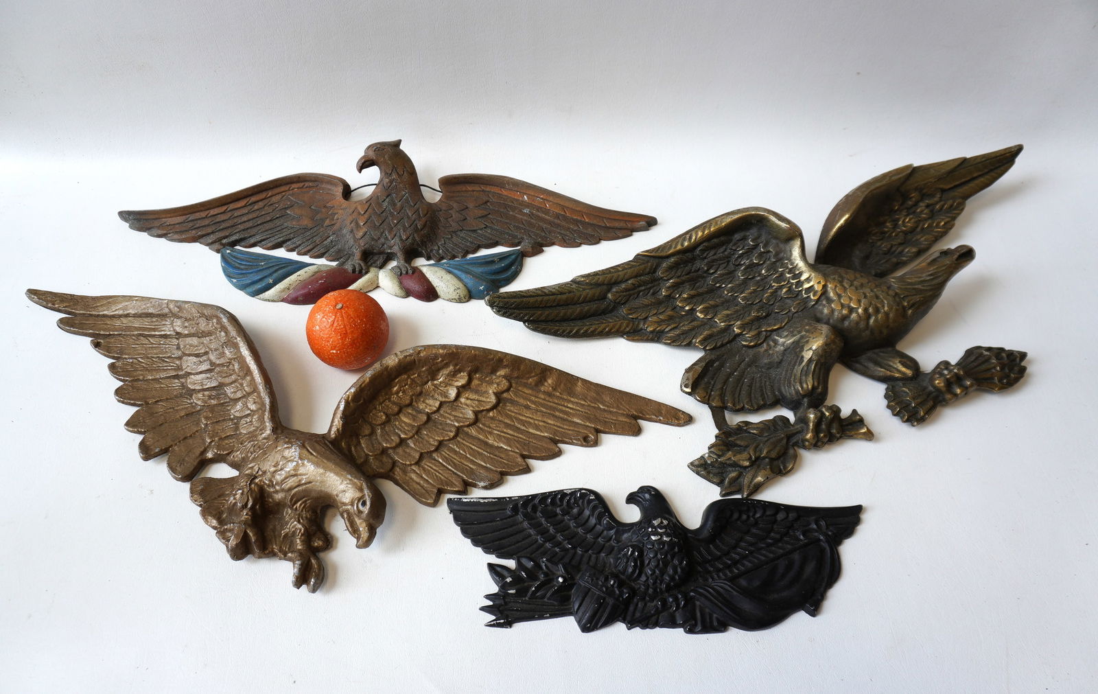 Grouping of 4 aluminum spread wing outdoor building ornaments in original paint. Includes one with (1 of 8)