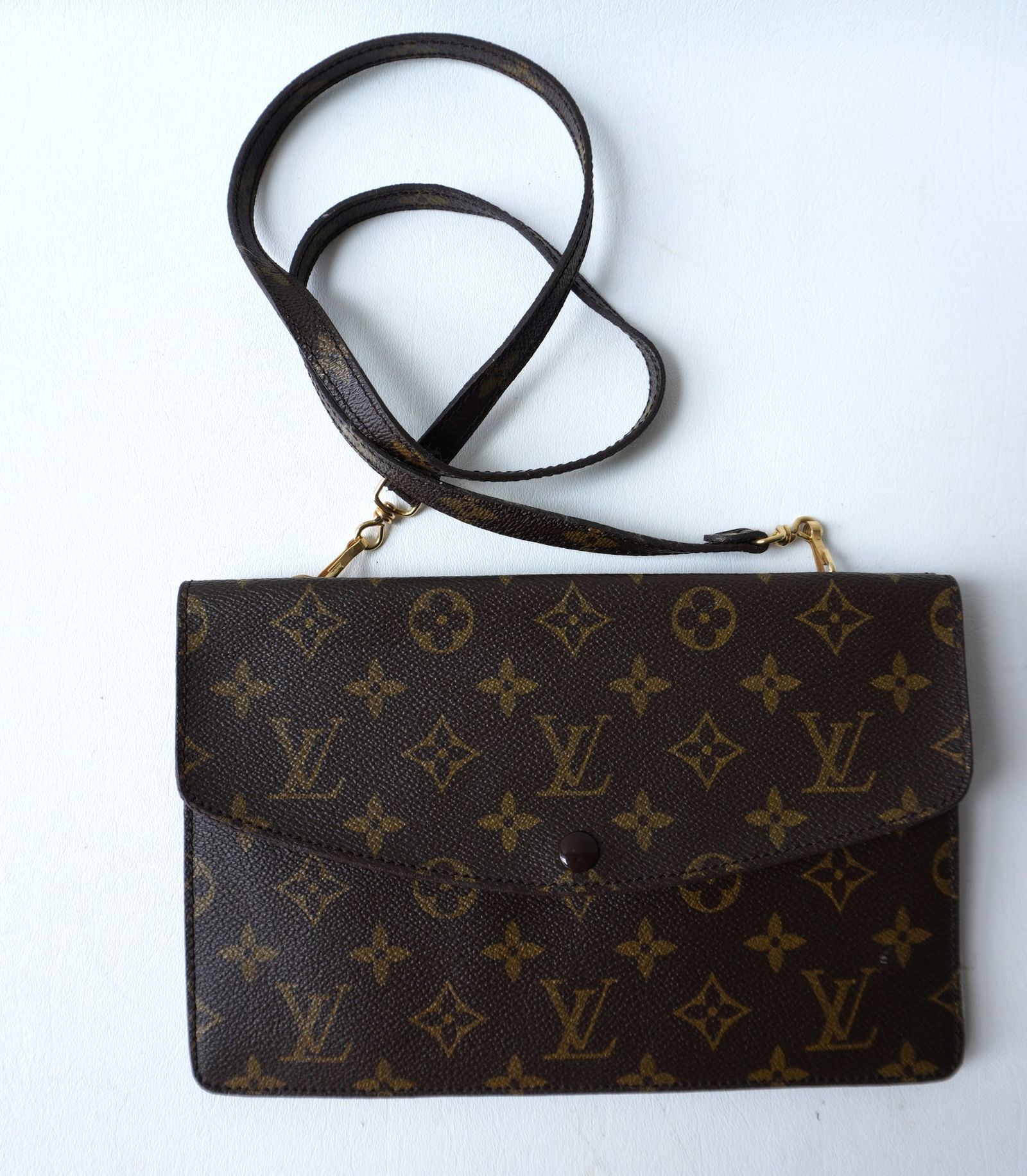 An authentic Louis Vuitton Lady's clutch bag, double side, with original storage bag, stamped "Louis (1 of 9)