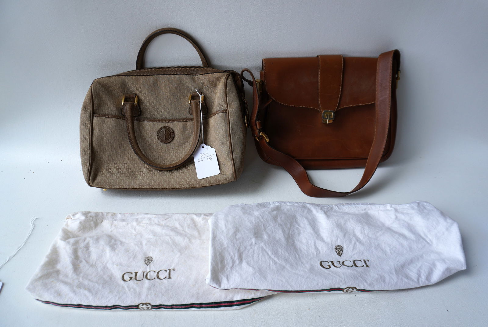 Two authentic Gucci lady's bags. The first, a leather shoulder bag stamped "Made In Italy By Gucci" (1 of 13)