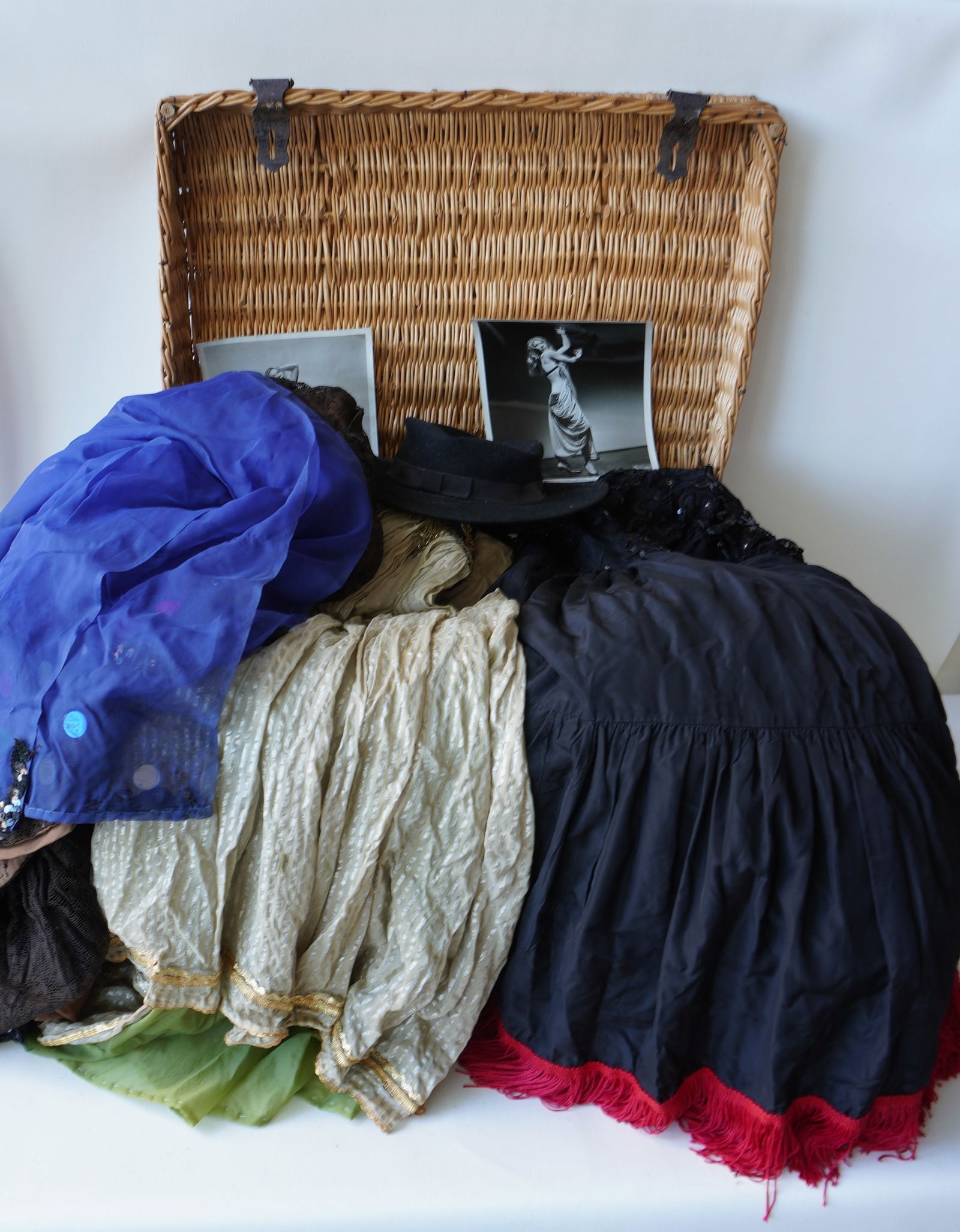 A grouping of vintage belly dancer costumes with 2 photographs of dancer. (1 of 20)