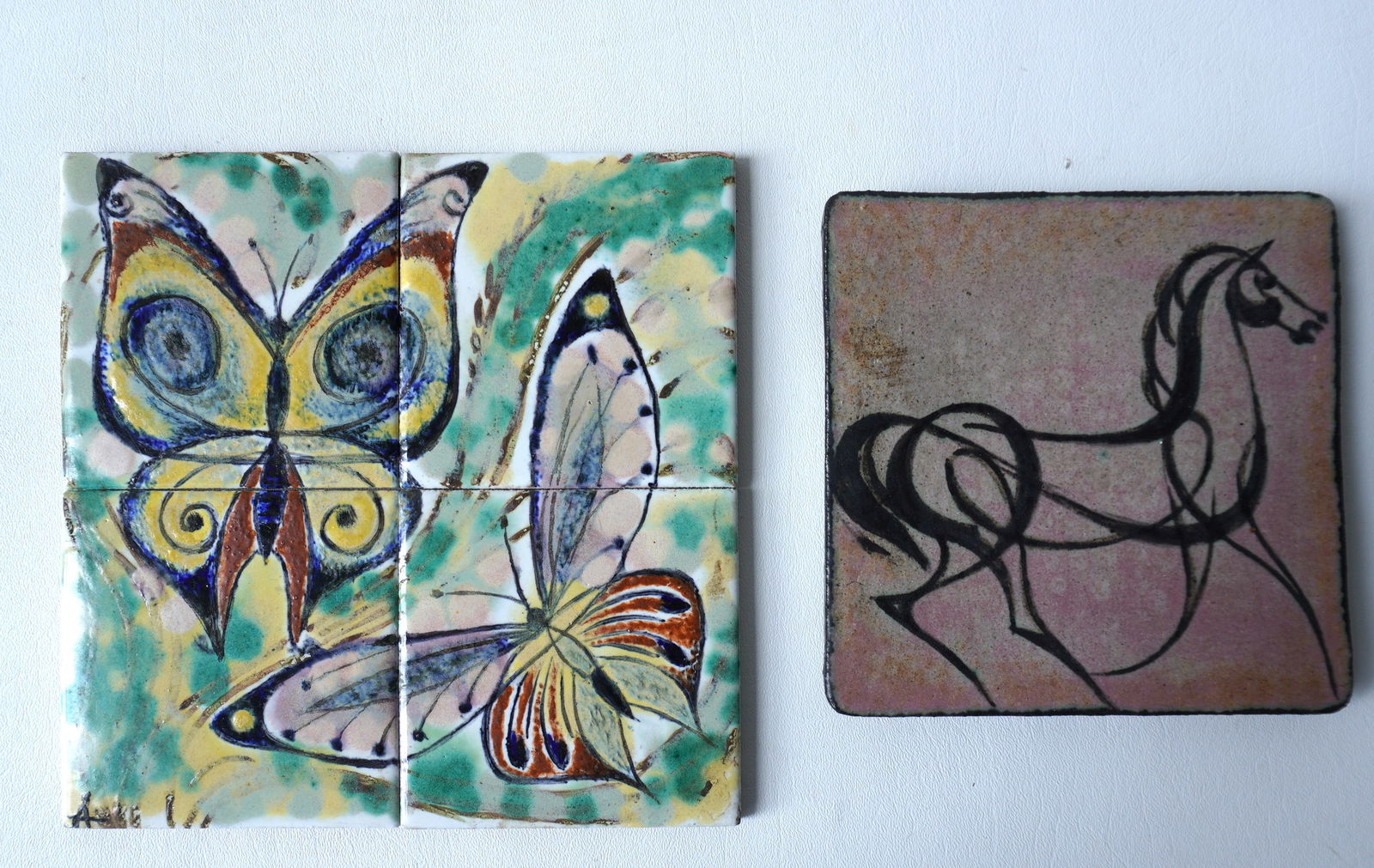 Walter Addison, New York, 1914-1982. Tile grouping including: A single tile decorated with a hand (1 of 5)