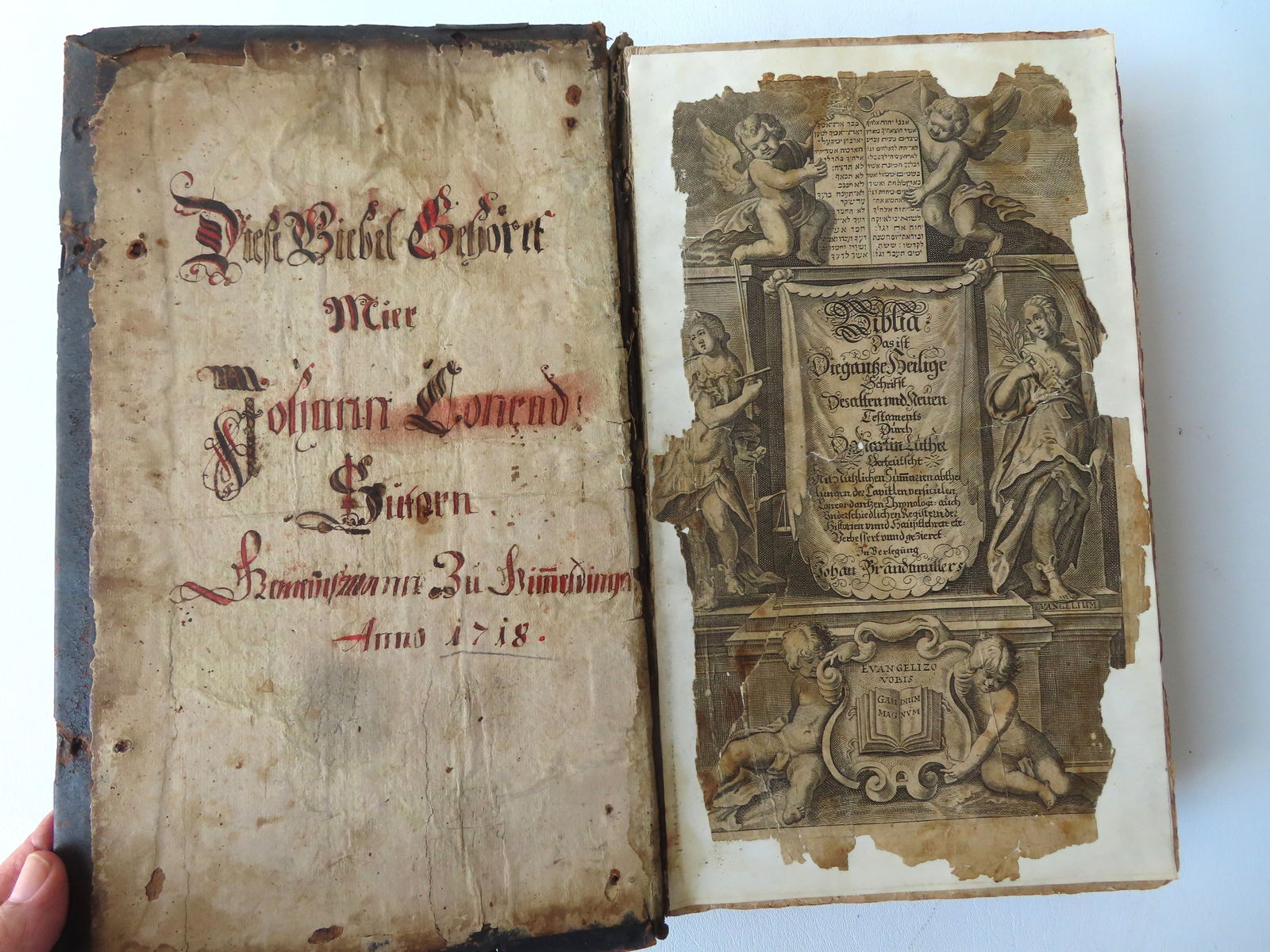 A German bible with pen and ink ownership signature written on inside of front cover and dated 1718. (1 of 11)