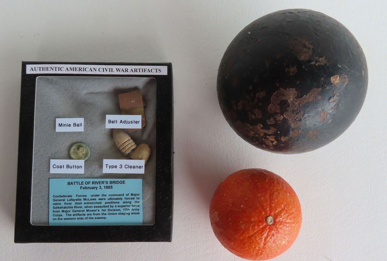 A grouping of Civil War artifacts including: Solid iron 14 pound cannon ball - 4 1/4" diameter - (1 of 6)