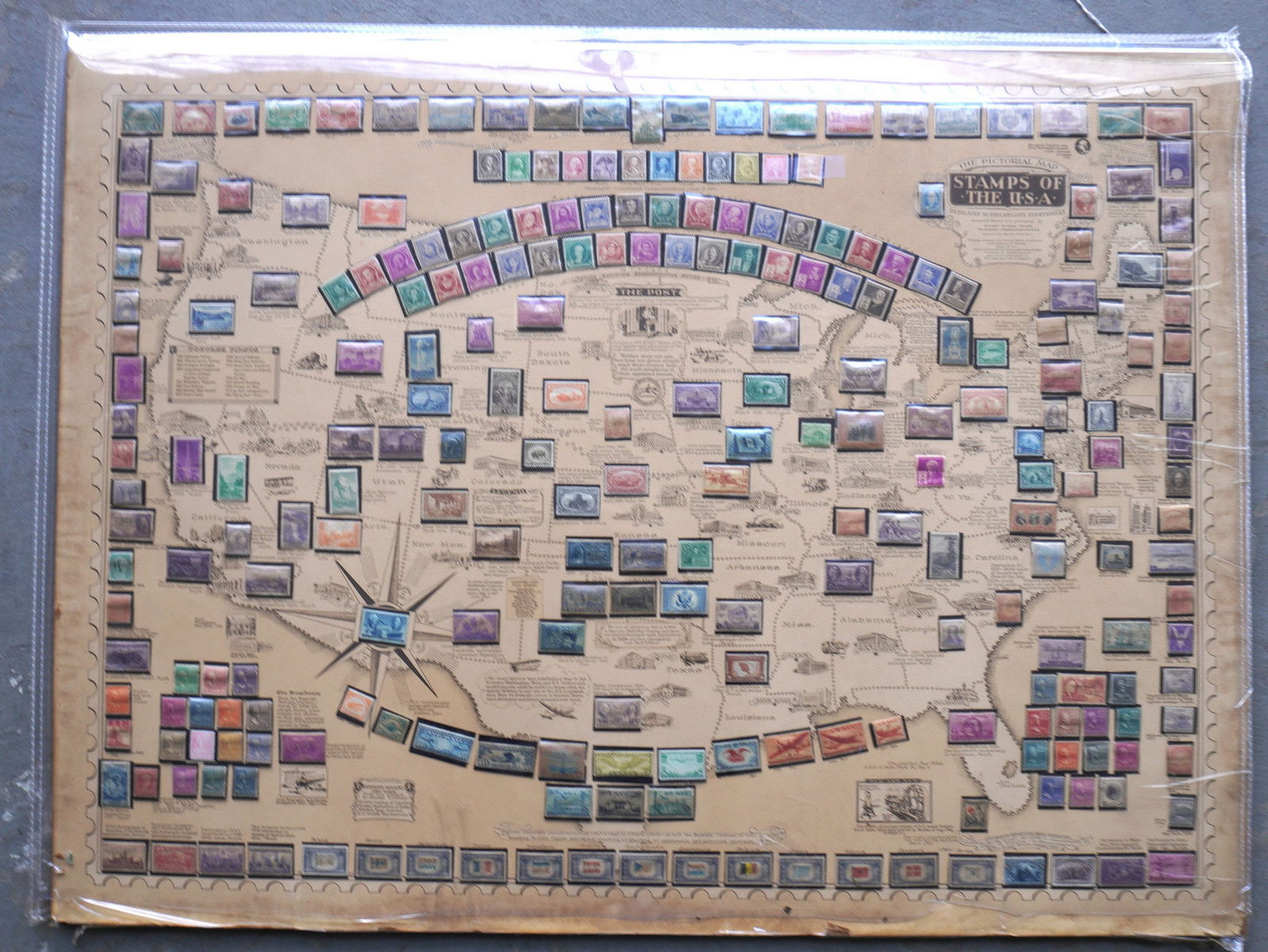 Large US stamp display titled "The Pictorial Map / STAMPS OF THE USA" "designed, drawn and published (1 of 6)