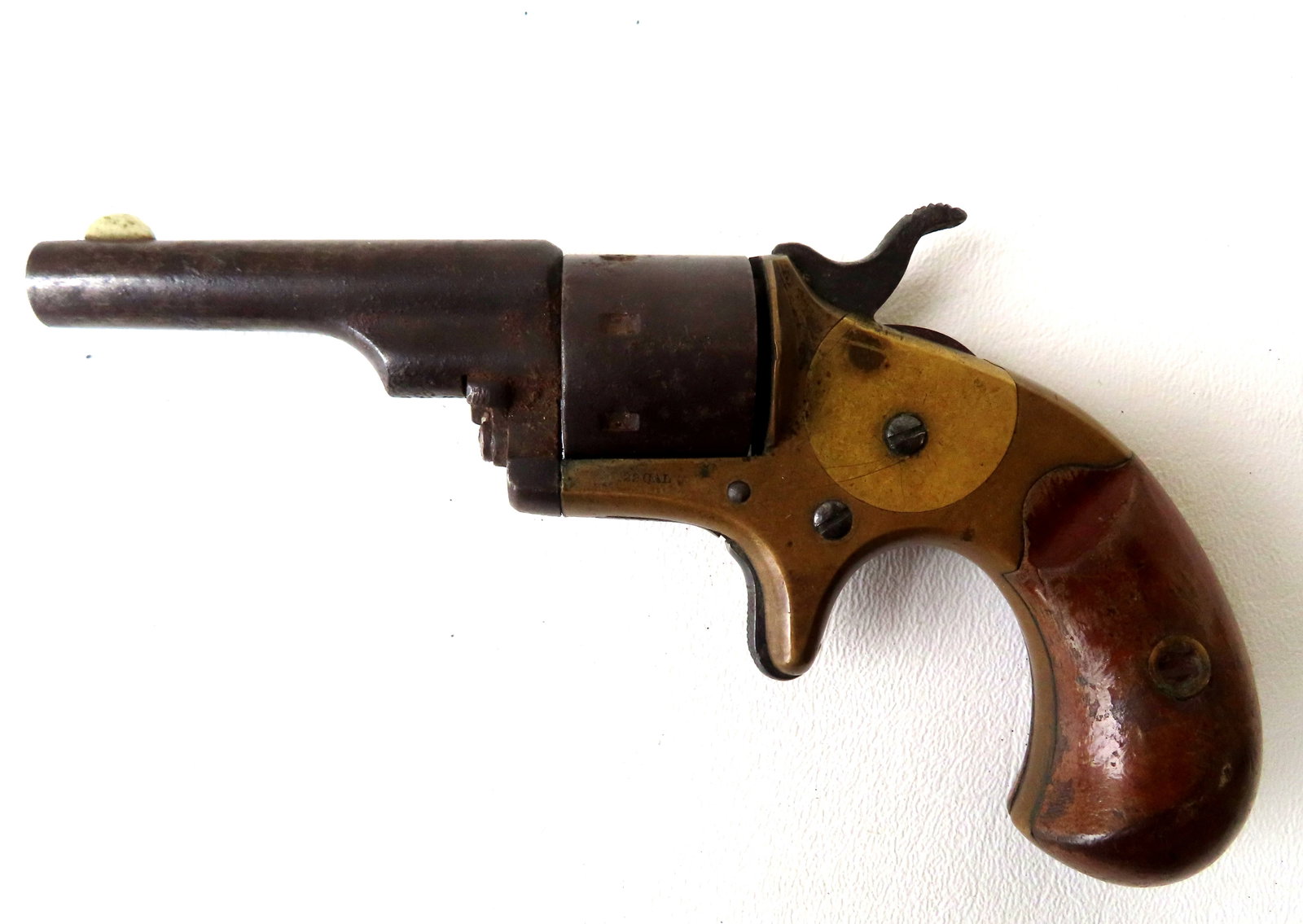 Colt open top 22 cal. pocket revolver, 7 shot, brass and steel with wood handles. Signed on barrel: Colt open top 22 cal. pocket revolver, 7 shot, brass and steel with wood handles. Signed on barrel "Colt's PT / F.A. Mfg. Co. / Hartford CT U.S.A.". Some use wear and minor rust on barrel, but in good