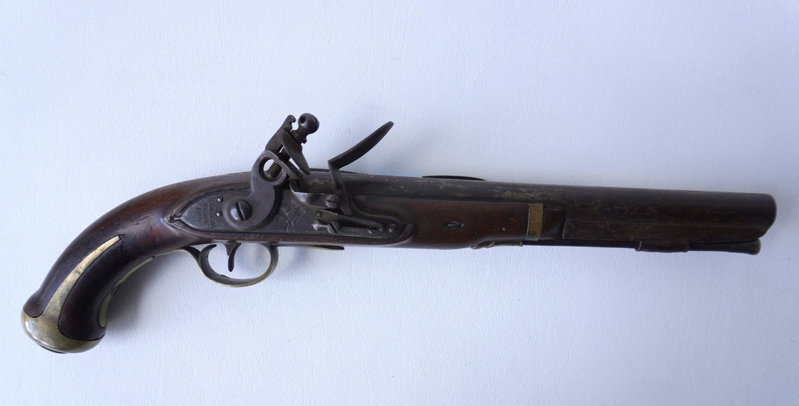 U.S. Model 1805 Harper's Ferry flintlock pistol with walnut stock. The lock plate marked "Harpers: U.S. Model 1805 Harper's Ferry flintlock pistol with walnut stock. The lock plate marked "Harpers Ferry 1807" - lock plate also impressed with a spread wing eagle and shield over "US" marking. Brass w