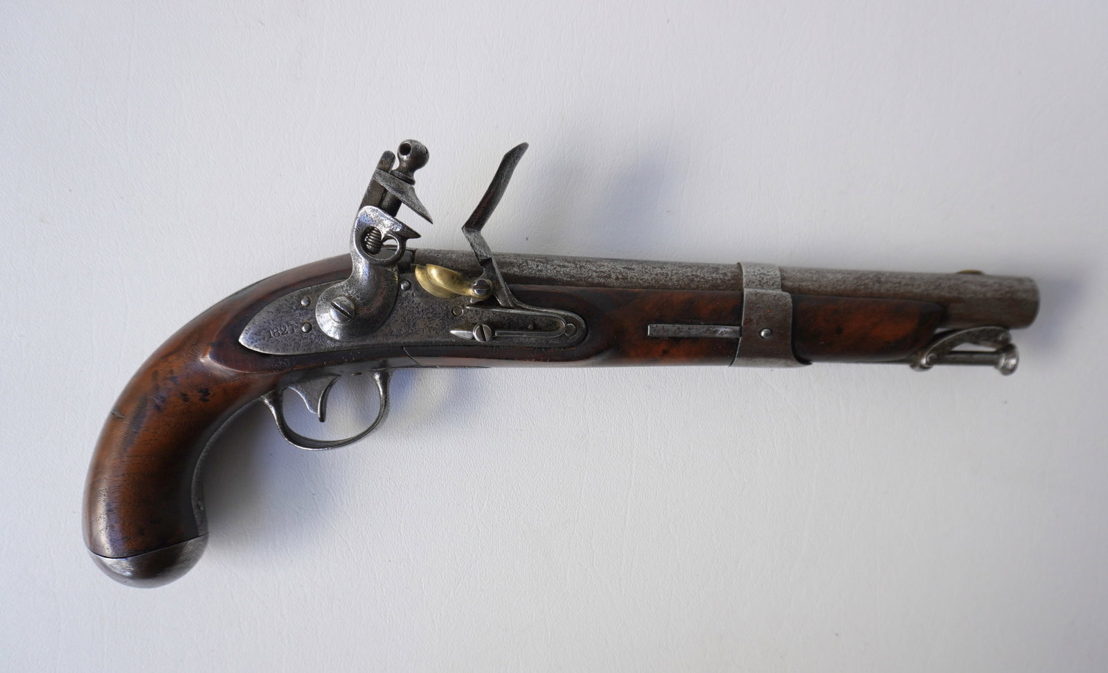 US Model 1826 Navy flintlock pistol with ramrod, and in working order. Pitting on lock plate with: US Model 1826 Navy flintlock pistol with ramrod, and in working order. Pitting on lock plate with remnants of identification which appears to read "1827 / U.S. / S. North" (Simeon North). Walnut stock