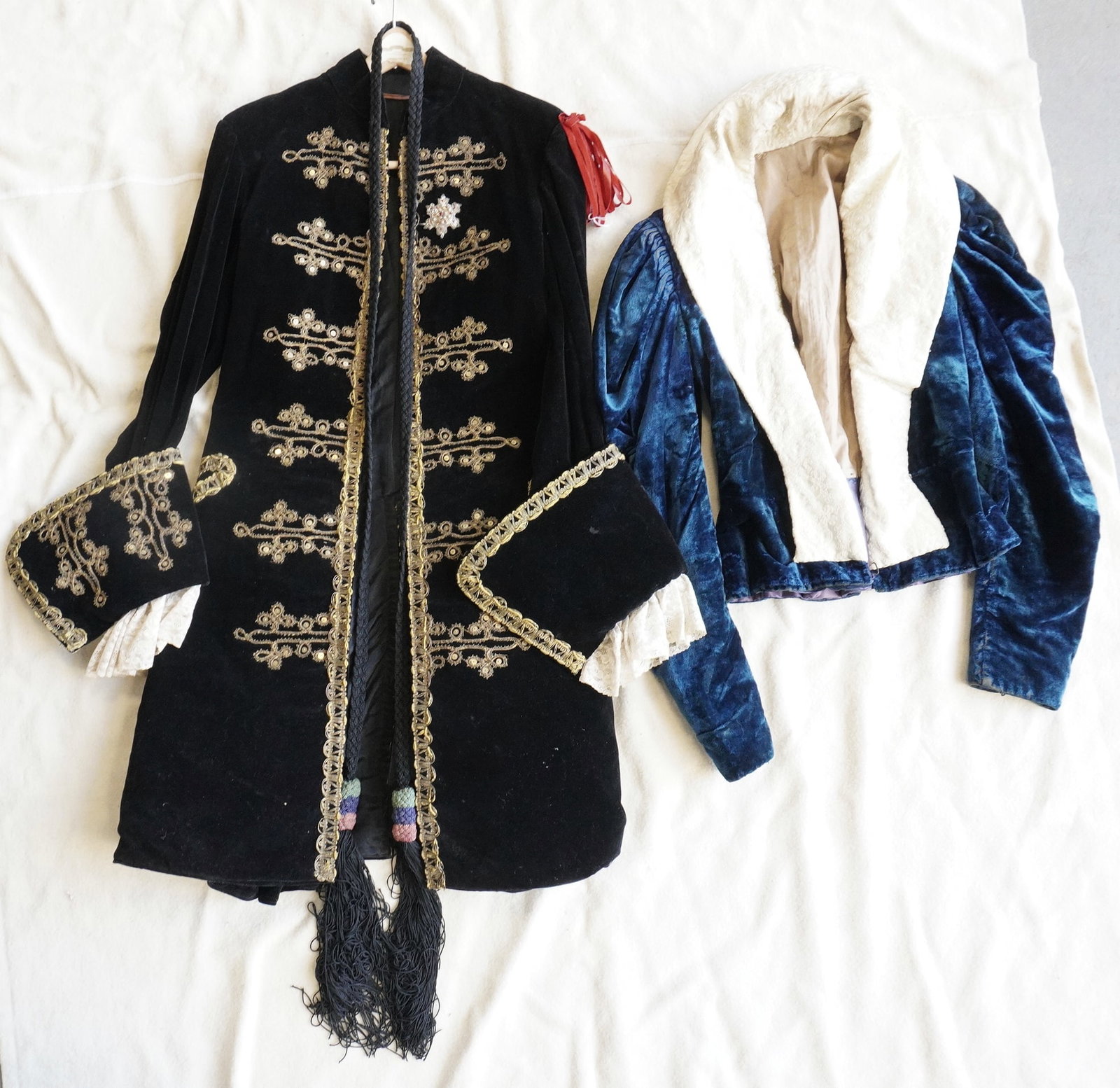 Two custom made theatrical costumes that appear to be designed from the Elizabethan era (royalty),: Two custom made theatrical costumes that appear to be designed from the Elizabethan era (royalty), but made during the 19th century. Includes a long gent's coat having a belt with tassels and with ela