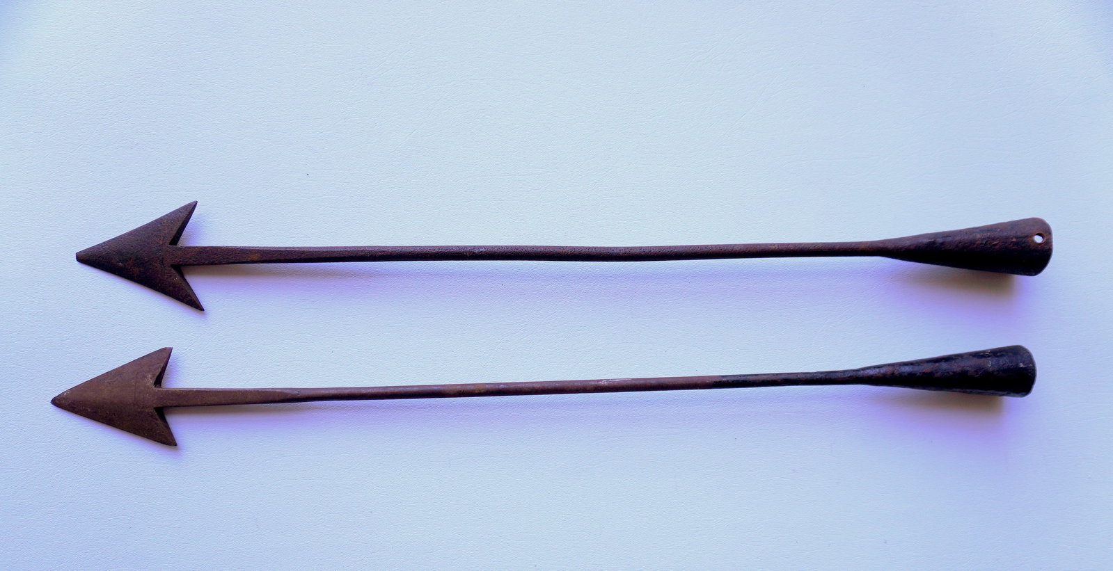 Two wrought iron whaling harpoons with forged iron cones that attach to shaft, probably 19th: Two wrought iron whaling harpoons with forged iron cones that attach to shaft, probably 19th century. One with slight loss at tip, else good condition. Each approximately 27 1/2"L. Provenance: From th